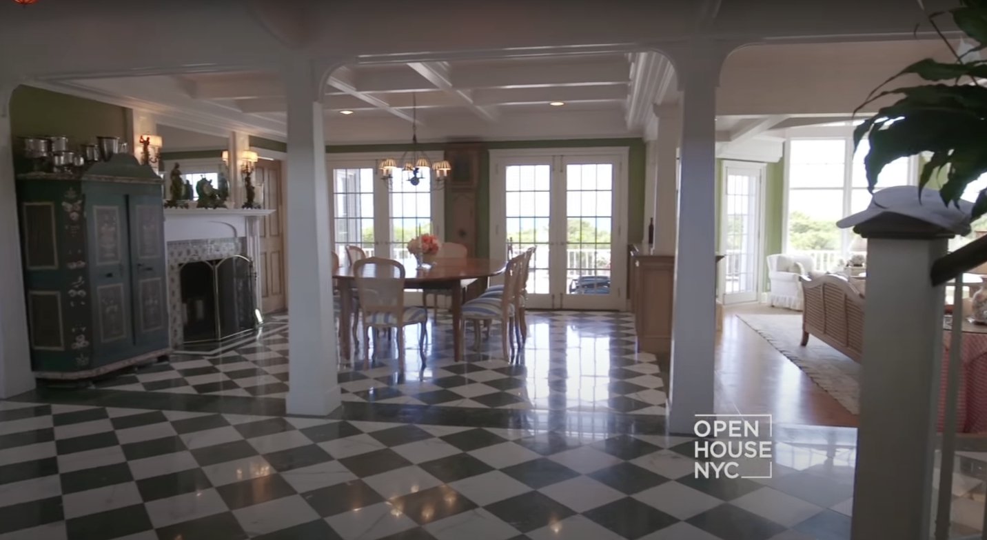 The spacious dining room with green and white floor marbles. | Source: youtube.com/Open House TV