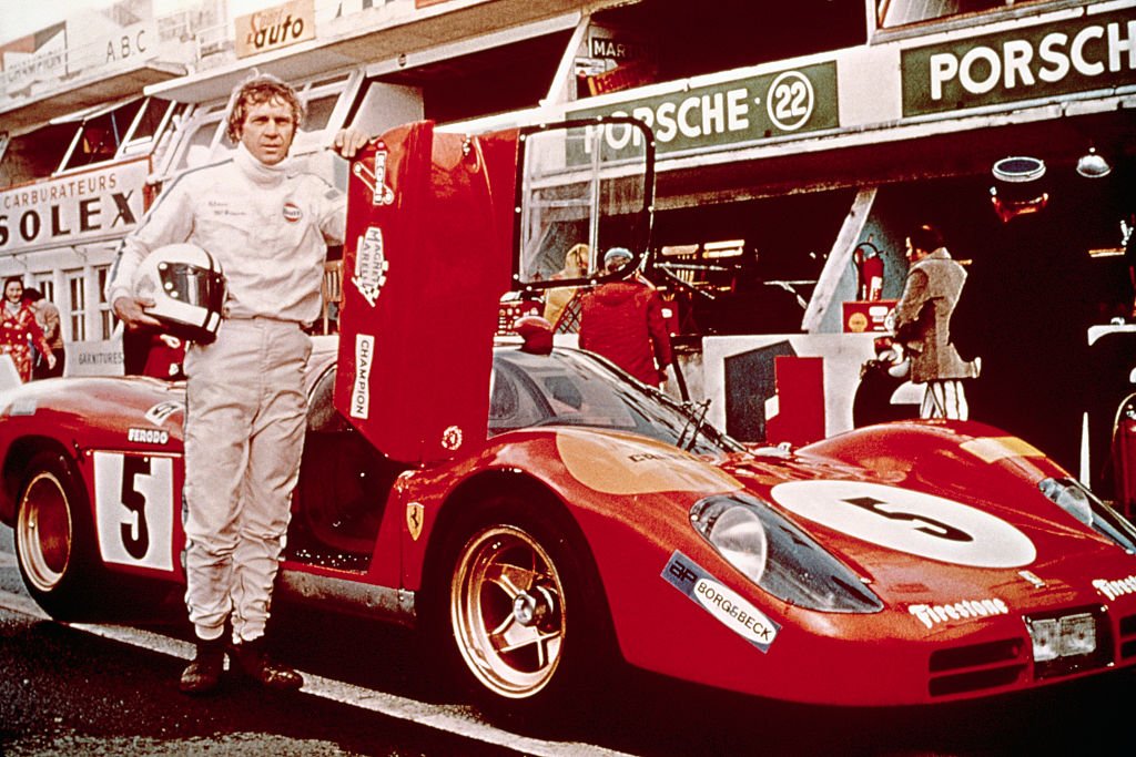 Steve McQueen poses by a race car for the movie "Le Mans" | Photo: Getty Images