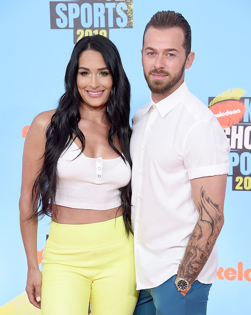 Nikki Bella and Artem Chigvintsev attending Nickelodeon Kids' Choice Sports 2019 at Barker Hangar Santa Monica, California in July 2019 | Photo: Getty Images.