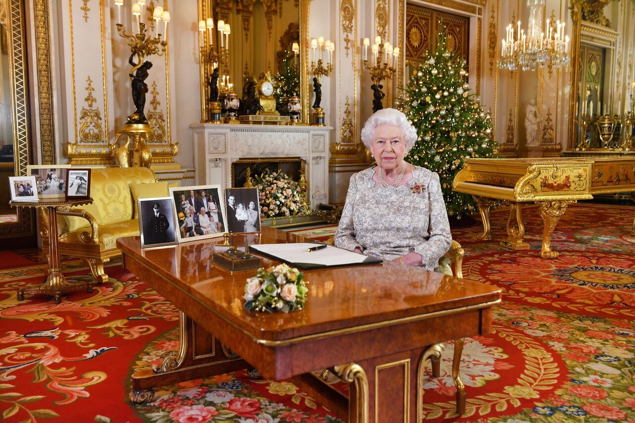 Queen Elizabeth II poses for a photo after she recorded her annual Christmas Day message, in the White Drawing Room at Buckingham Palace. | Source: Getty Images
