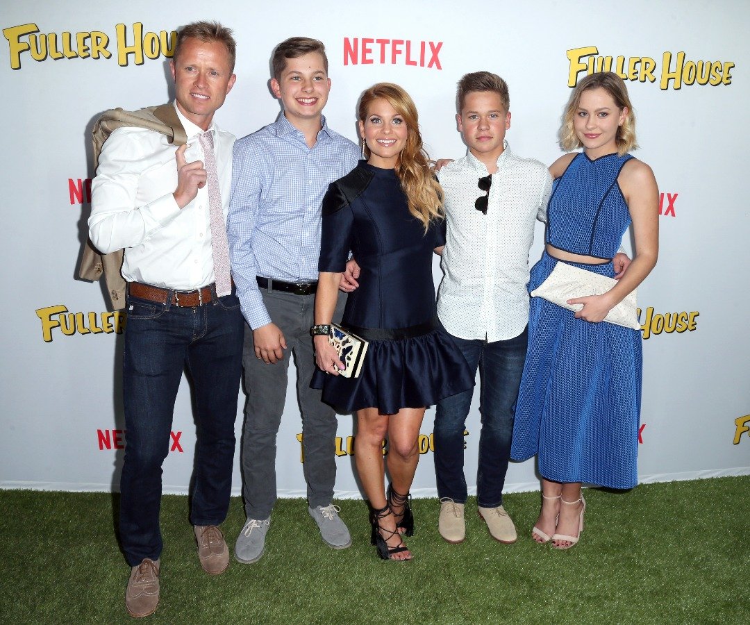 Professional hockey player Valerie Bure, Lev Valerievich Bure, actress Candace Cameron-Bure, Maksim Valerievich Bure, and Natasha Bure at the premiere of Netflix's "Fuller House" at Pacific Theatres at The Grove on February 16, 2016 in Los Angeles, California. | Source: Getty Images