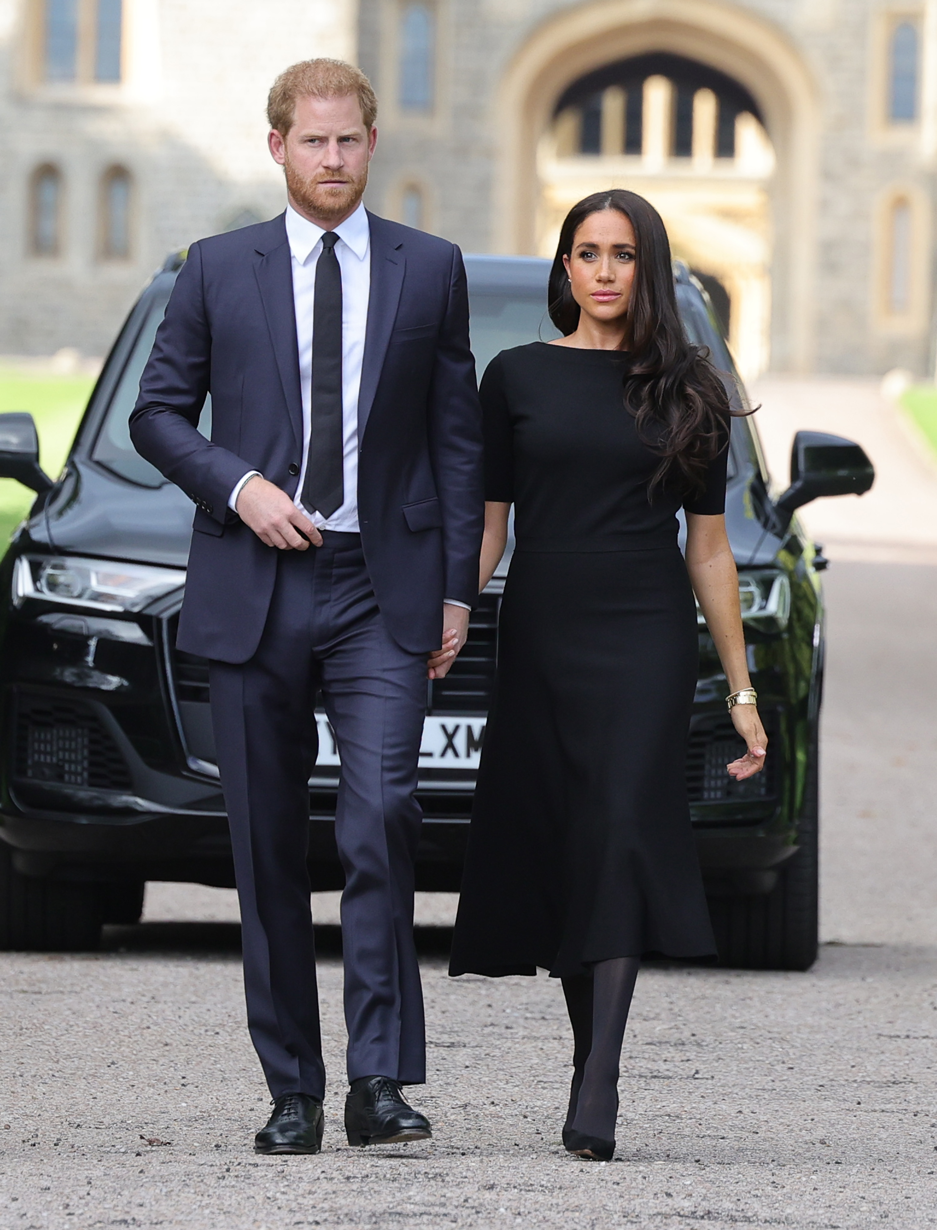 Meghan Markle and Prince Harry arrive on the long Walk at Windsor Castle arrive to view flowers and tributes to HM Queen Elizabeth on September 10, 2022 in Windsor, England | Source: Getty Images