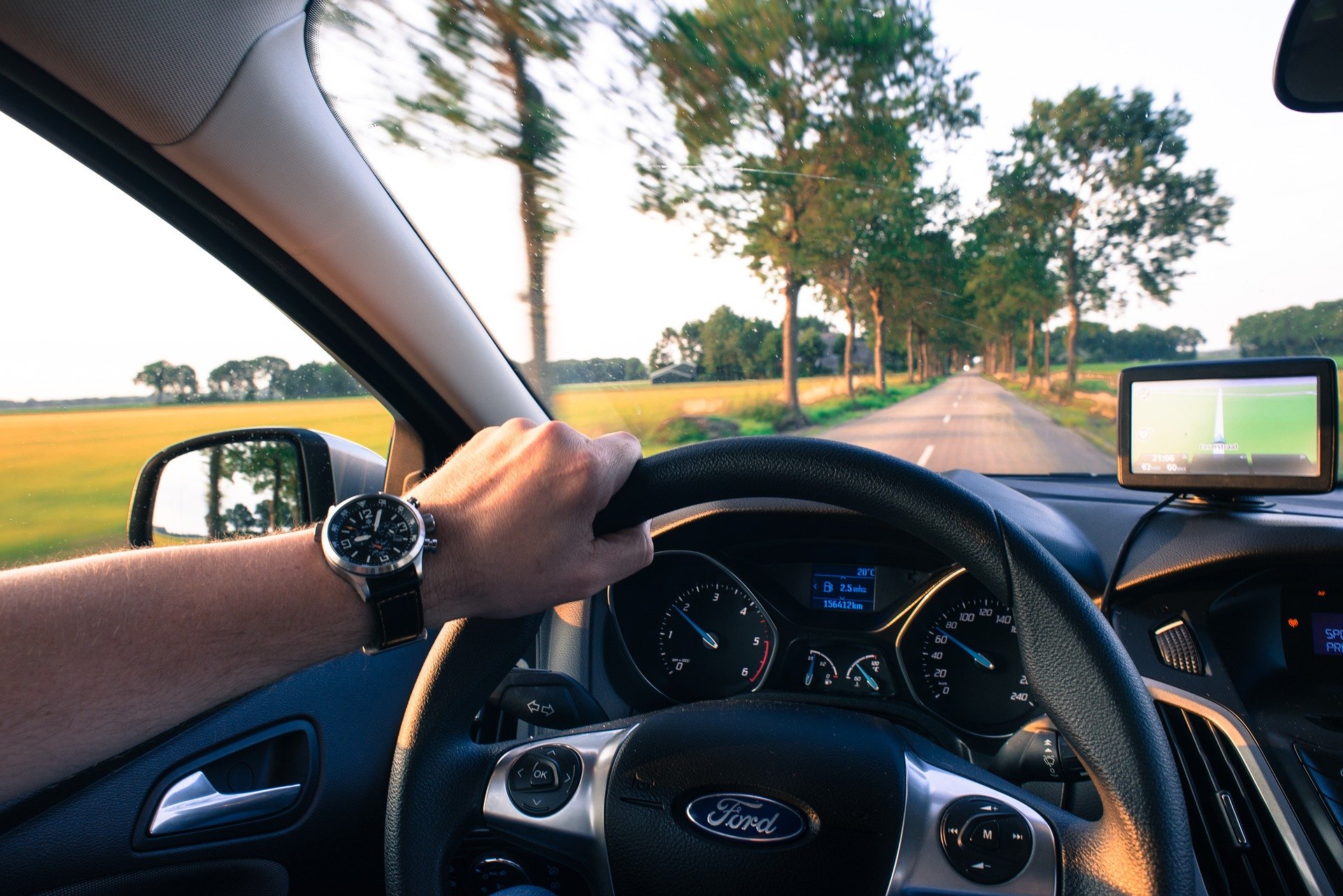 Pictured - A man driving using the navigation system | Source: Pixabay