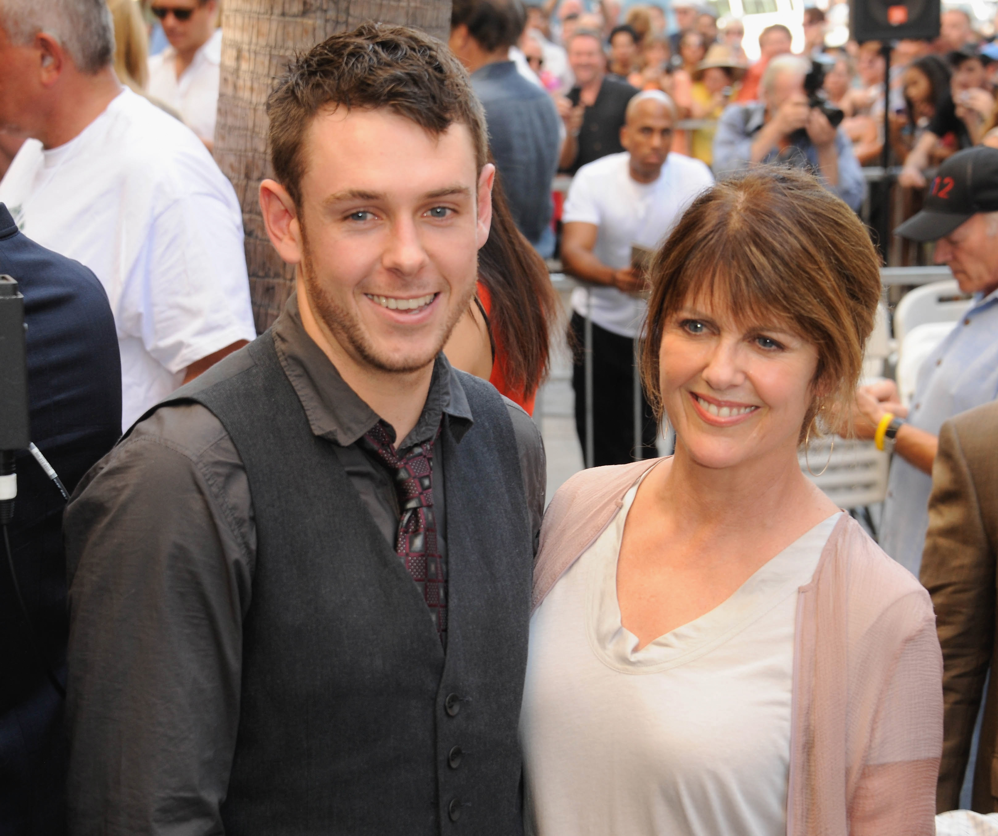 Sean Harmon and Pam Dawber at the Mark Harmon star ceremony on the Hollywood Walk of Fame on October 1, 2012, in California. | Source: Getty Images
