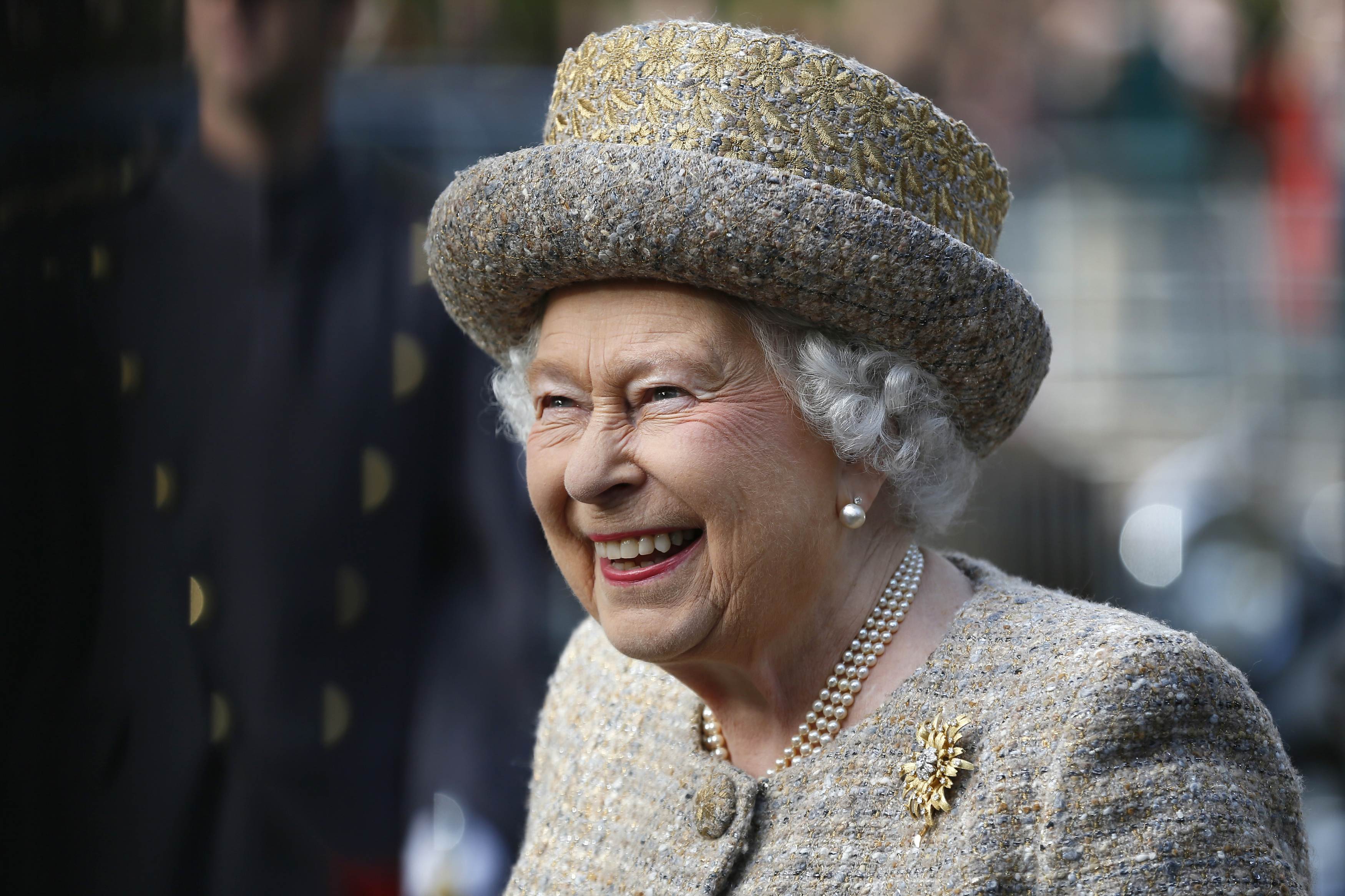 Queen Elizabeth II smiles as she arrives in London, England, before the Flanders' Fields Memorial Garden Opening at Wellington Barracks on November 6, 2014. | Source: Getty Images