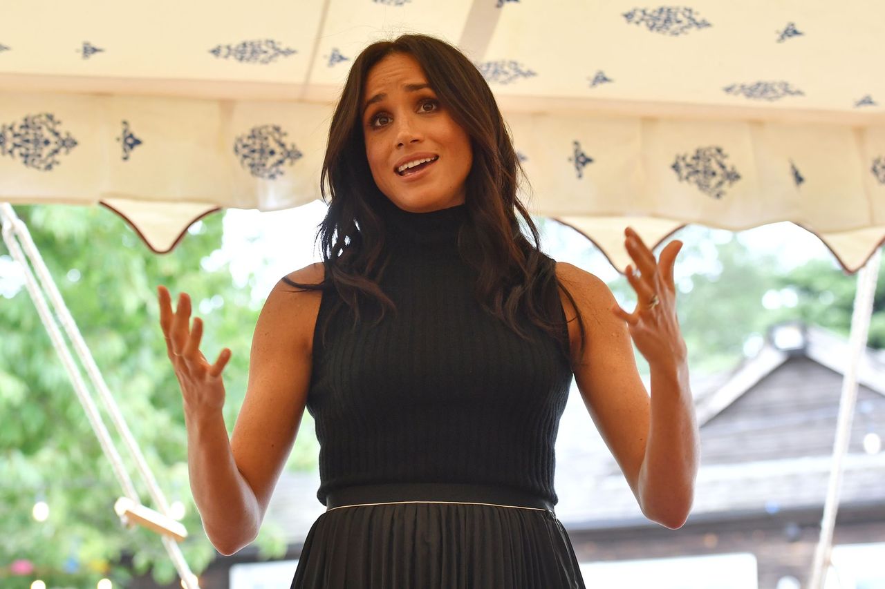 Meghan Markle talks to guests during an event at Kensington Palace on September 20, 2018 in London, England. | Source: Getty Images