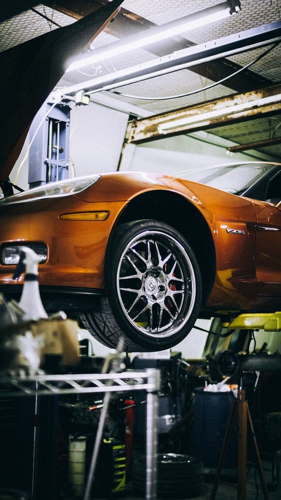 A Corvette in a body shop | Source: Unsplash
