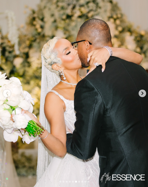 LeToya Luckett and Taleo Coles sharing a kiss on their wedding day, posted on August 1, 2024 | Source: Instagram/essence and letoyaluckett