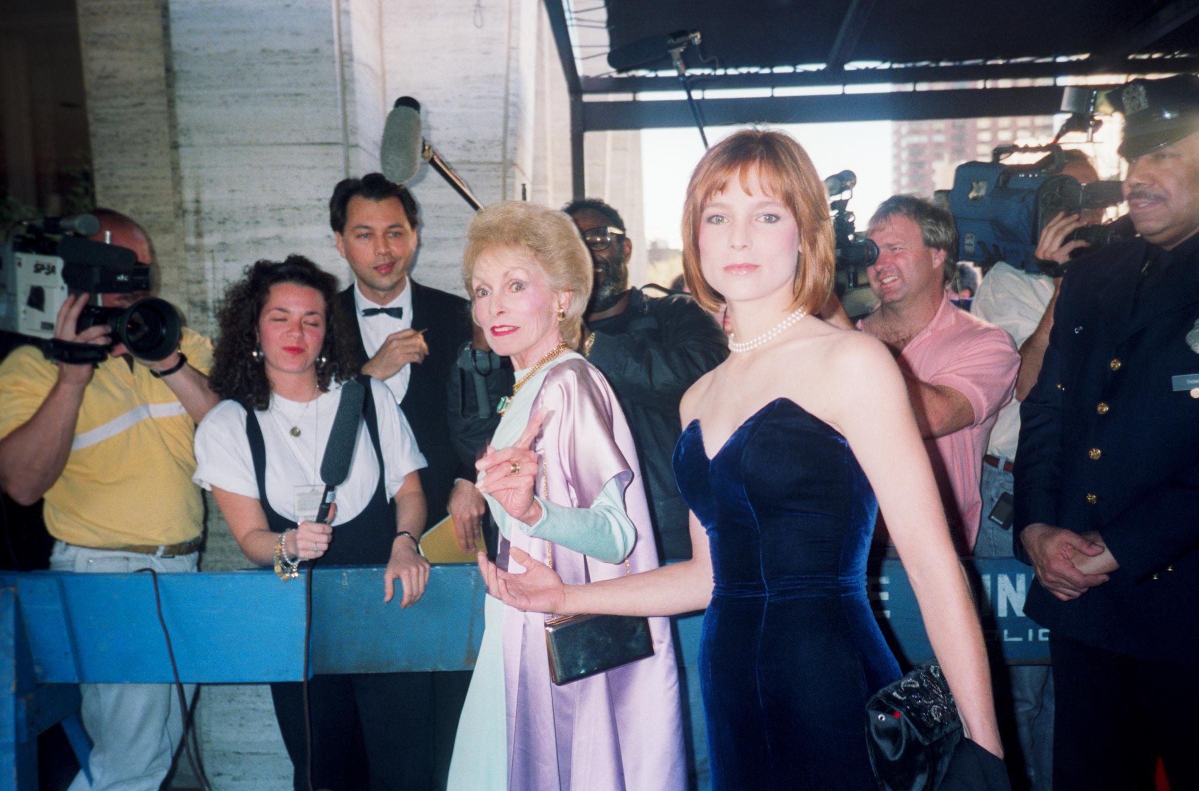 Kelly Curtis with her mother Janet Leigh on the red carpet with a photographer in the background circa 1990 in New York City | Source: Getty Images