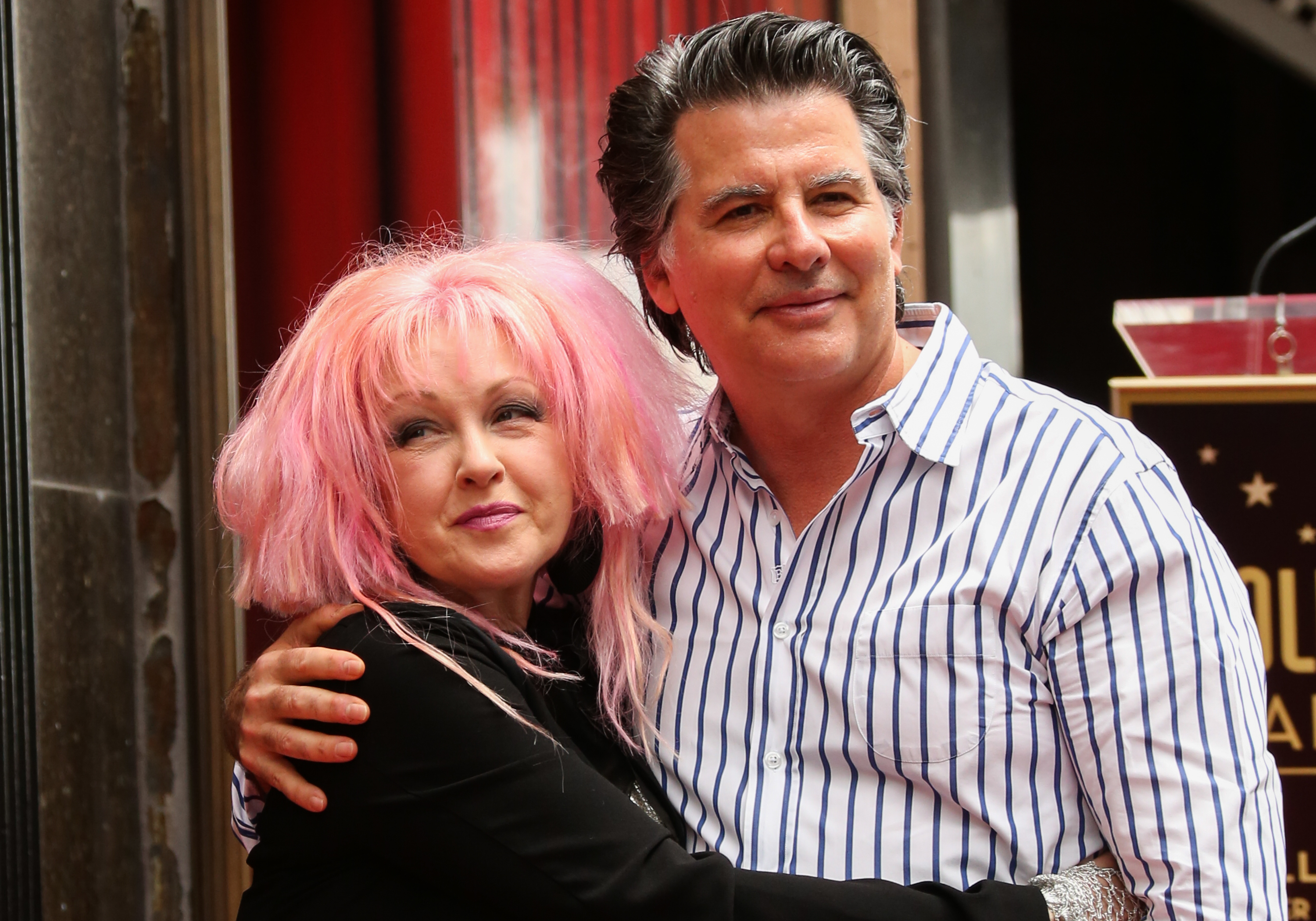 Cyndi Lauper and David Thornton at the ceremony to honor the singer and Harvey Fierstein as they both received stars on The Hollywood Walk of Fame on April 11, 2016, in Hollywood, California | Source: Getty Images