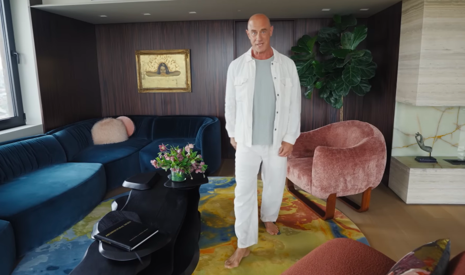 Christopher happily handed Sherman the credit for the entire design, joking that when it comes to style, "I just act." Standing among the curved furniture and saturated colors, he looked perfectly at home in her vision. | Source: YouTube/Architectural Digest