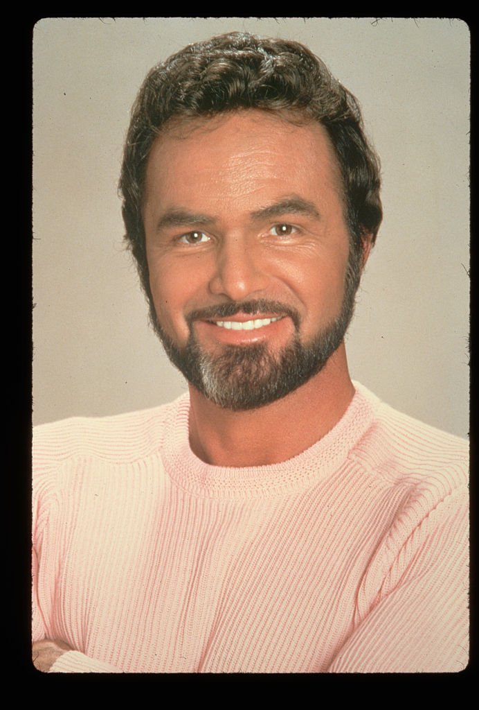 A head shot image of Burt Reynolds flashing on December 22, 2017 in Amsterdam, Netherlands | Photo: Getty Images