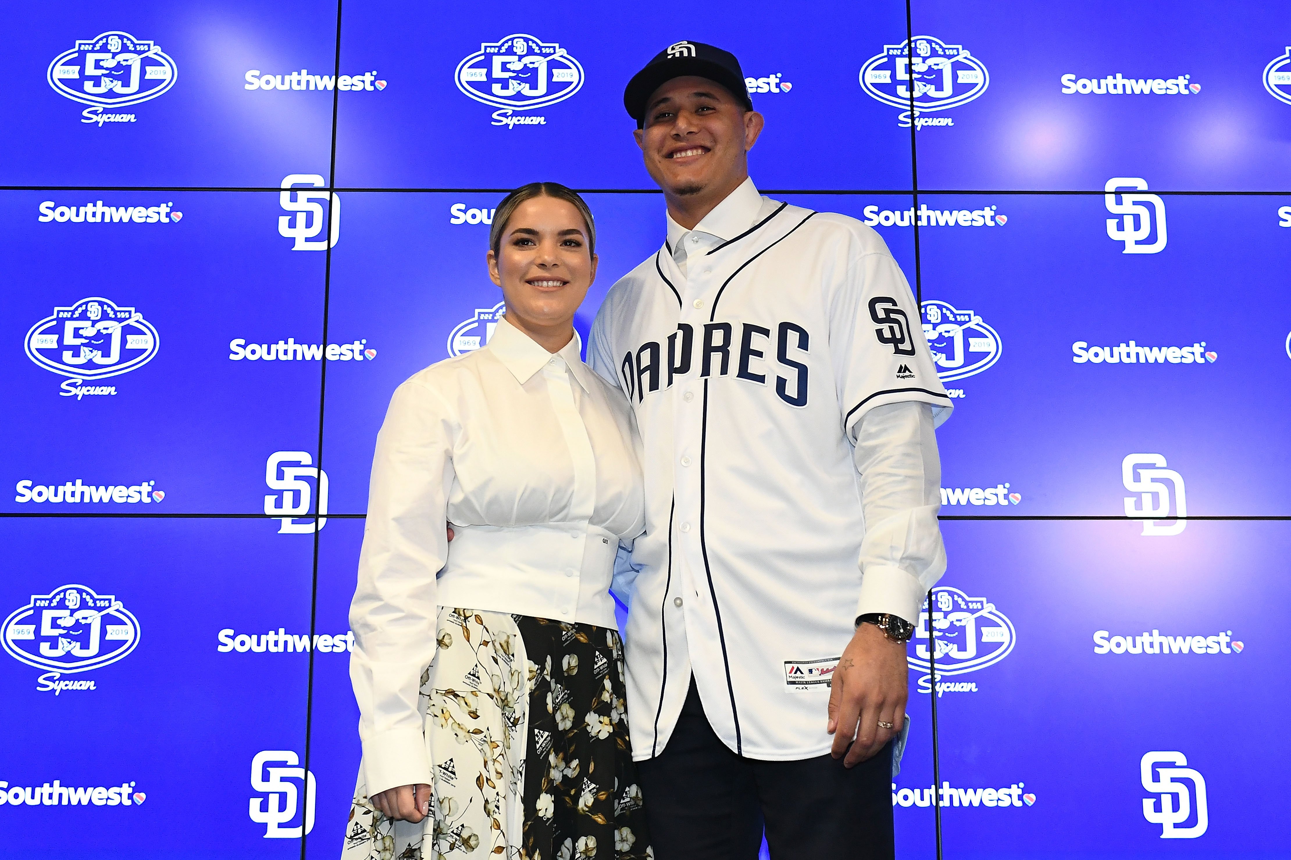 Manny Machado and his wife Yainee Alonso pose for a photo at Peoria Stadium on February 22, 2019, in Peoria, Arizona. | Source: Getty Images