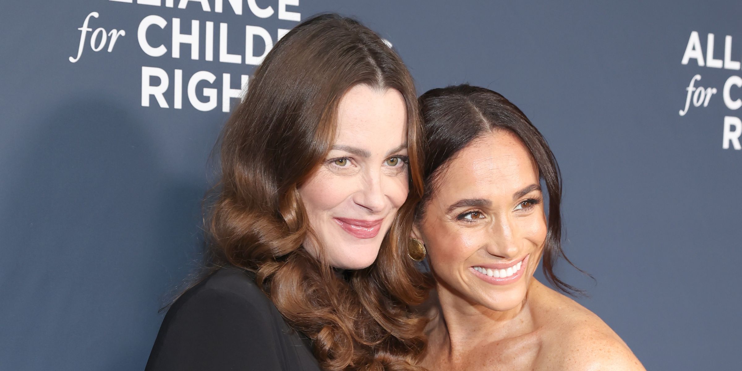 Kelly McKee Zajfen and Meghan Markle | Source: Getty Images