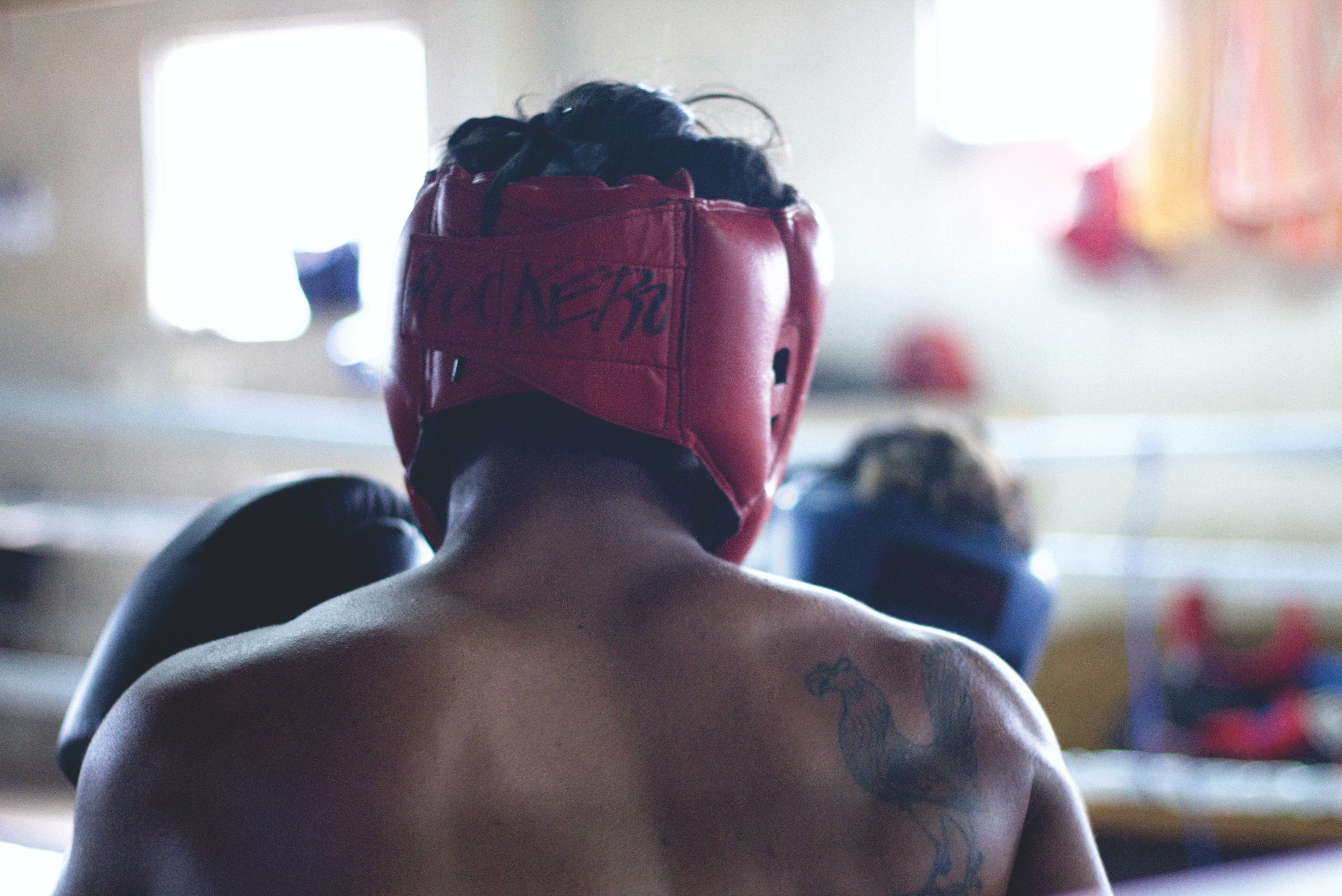 Boxer wearing a head protector | Source: Unsplash / Nathz Guardia