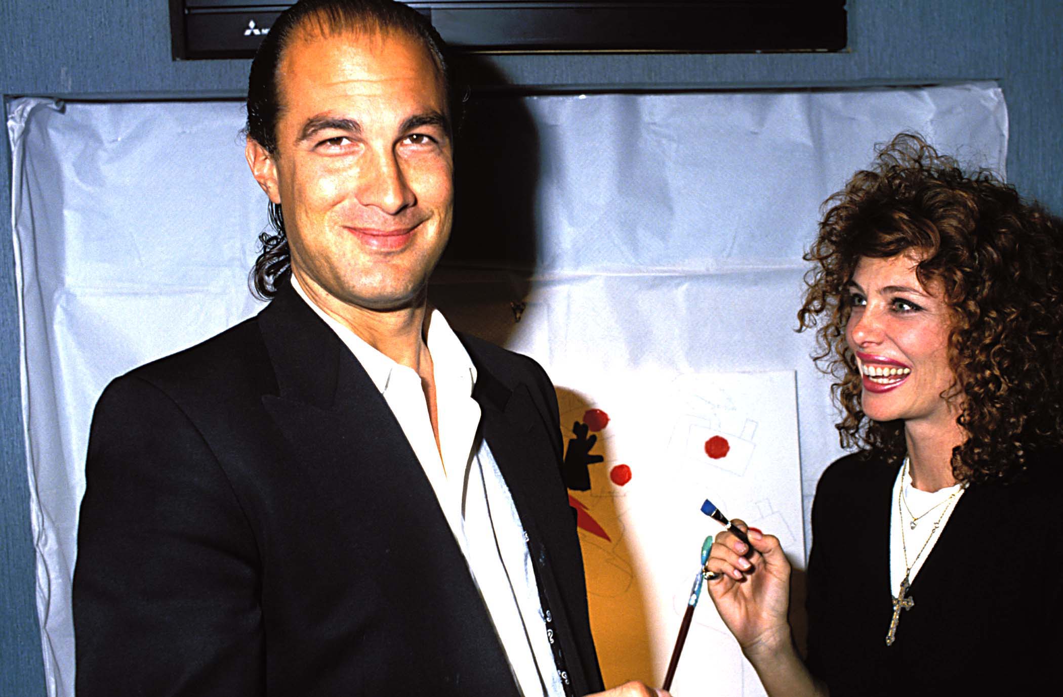 Steven Seagal and Kelly LeBrock during a party for artist Kostabi in Beverly Hills, California. / Source: Getty Images