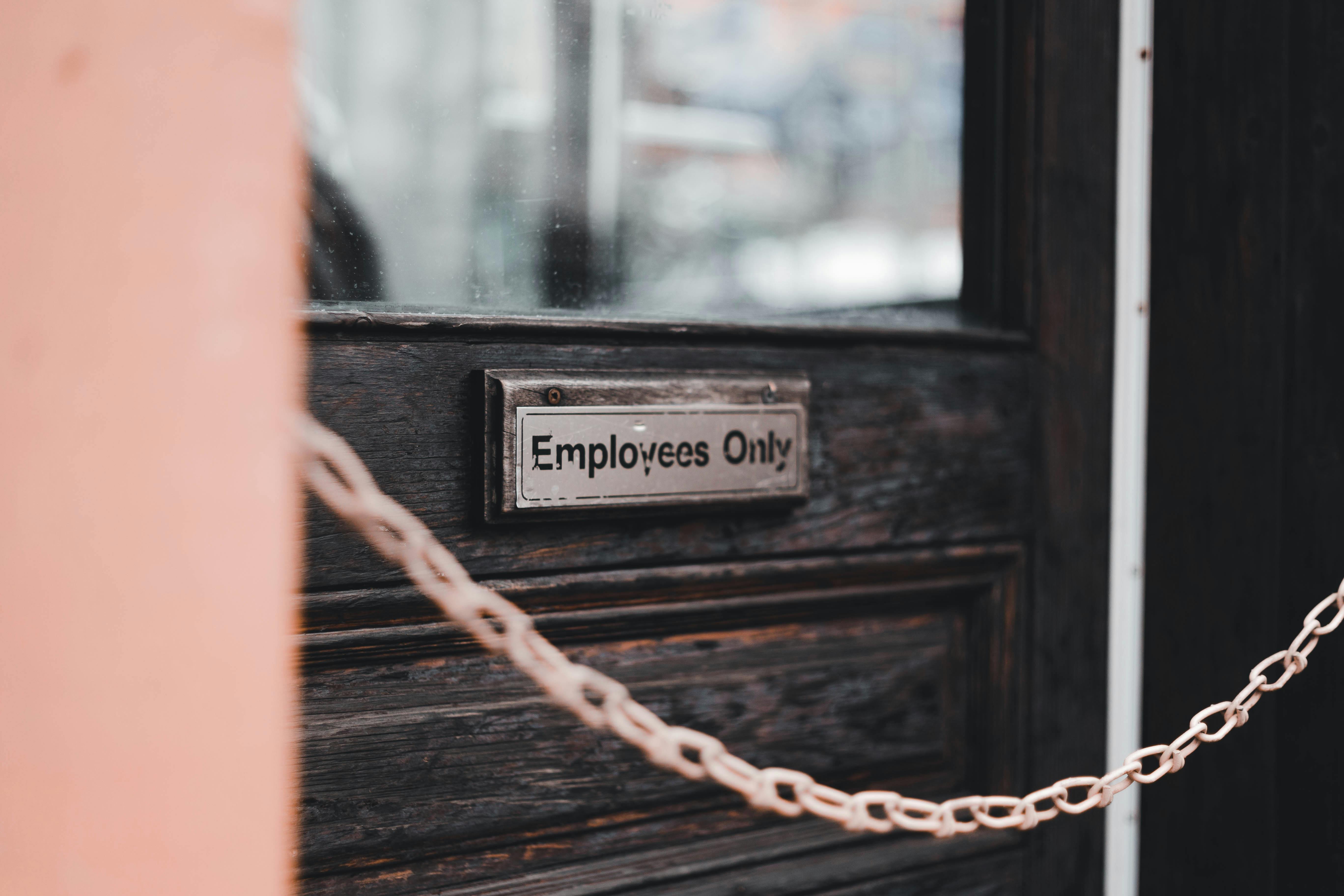 Signage indicating employees only. | Source: Pexels