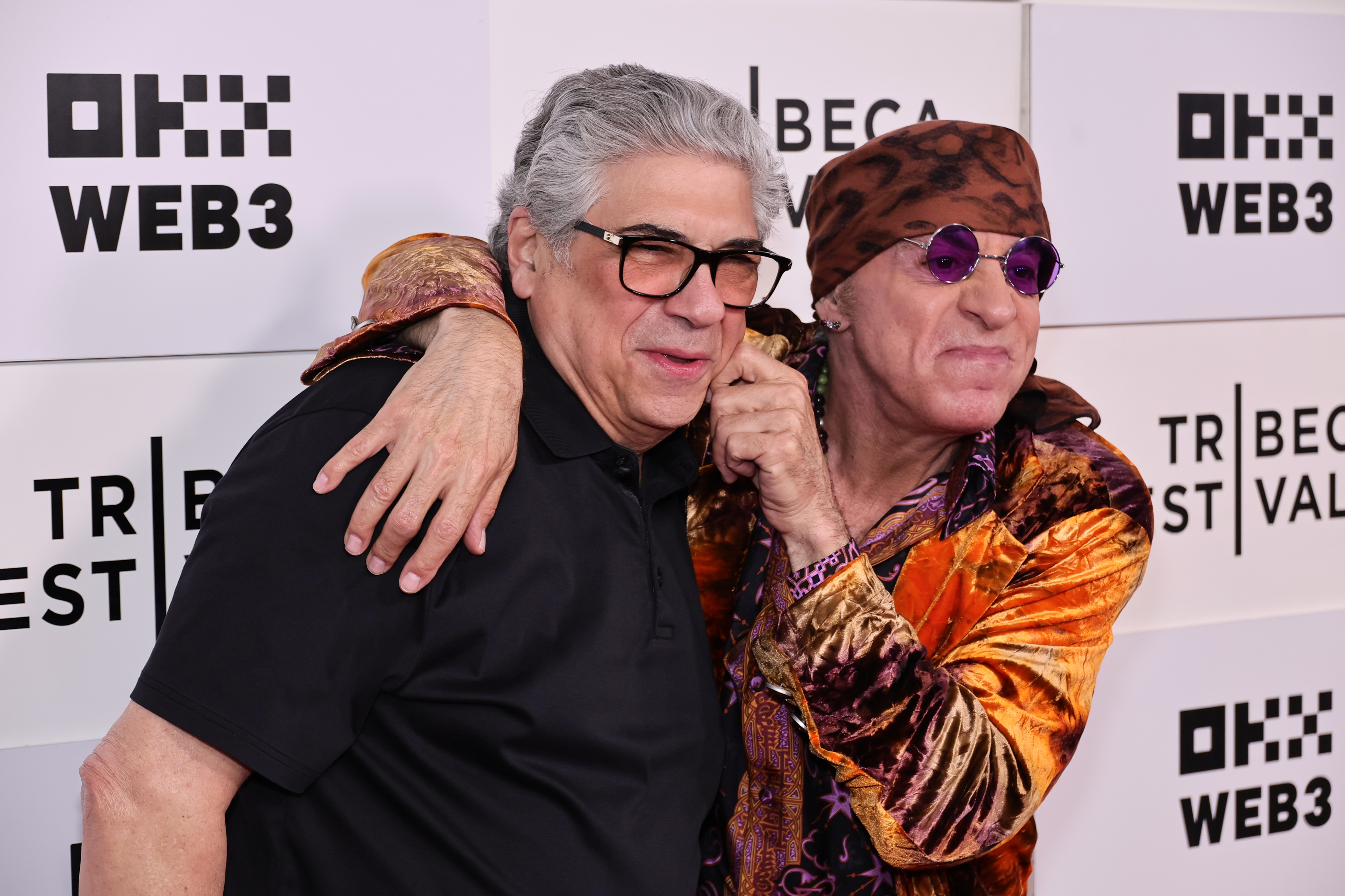 Vincent Pastore and Steven Van Zandt share a lighthearted moment at the premiere of "Stevie Van Zandt: Disciple." The event became one of Pastore's final public appearances, with the longtime friends smiling for photographers as Van Zandt playfully pinched his co-star's cheek. | Source: Getty Images
