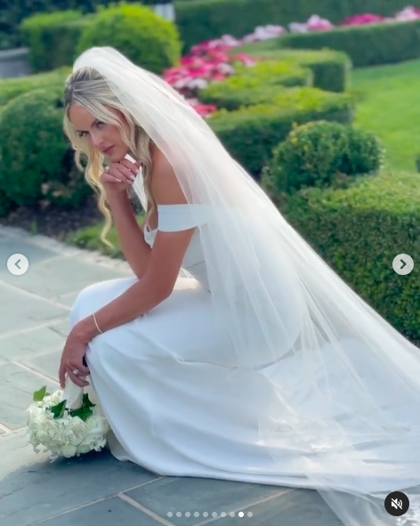 Victoria Schultz posing for a picture in her wedding gown, posted on July 26, 2024 | Source: Instagram/antpagephoto and alenkafilms