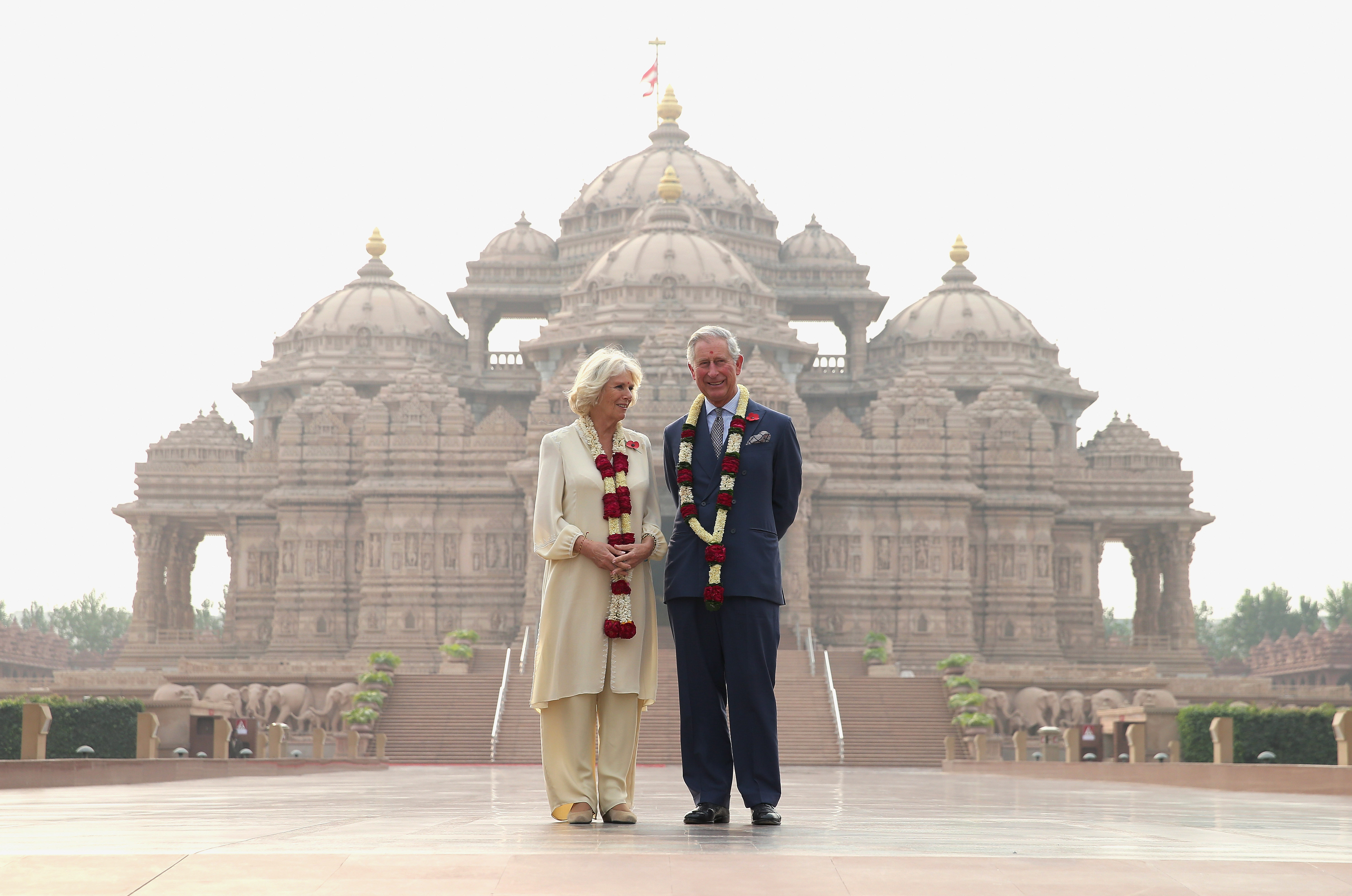 Camilla, now Queen, and Prince Charles, now King, pose outside the Akshardham Temple during day 3 of an official visit to India on November 8, 2013, in Delhi, India | Source: Getty Images