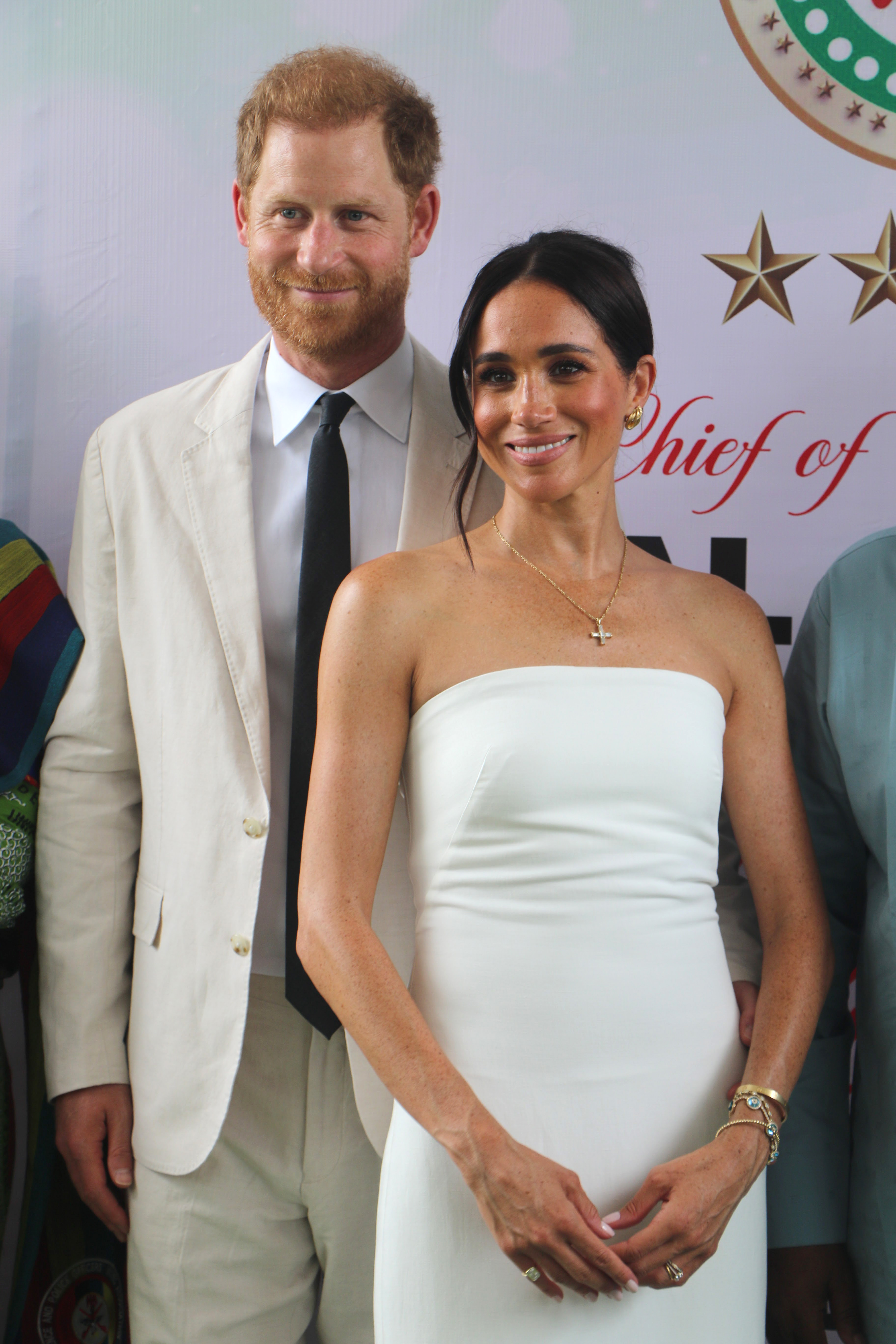 Prince Harry and Meghan Markle pose for a photo as they attend the program held in the Armed Forces Complex on May 11, 2024, in Abuja, Nigeria. | Source: Getty Image