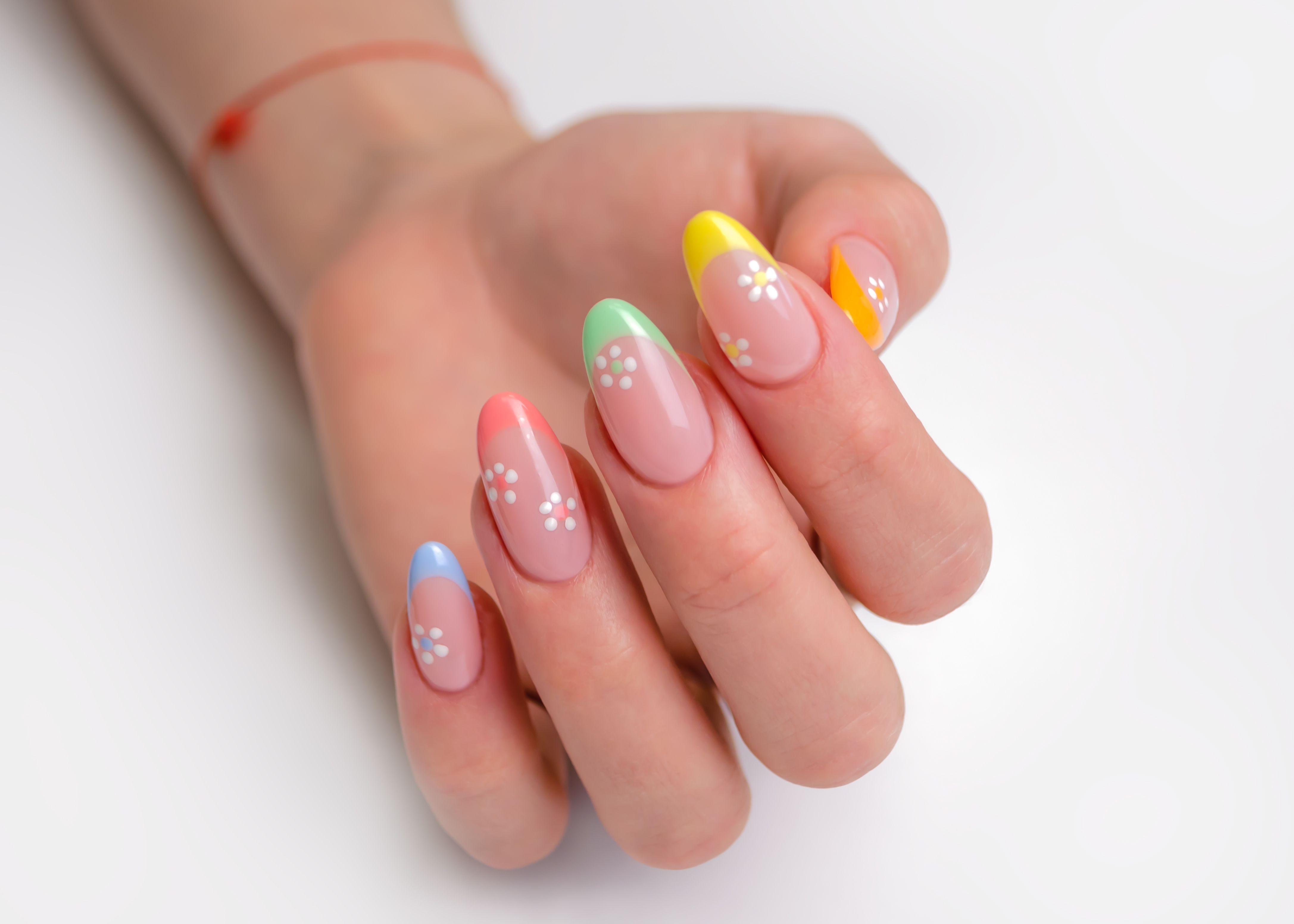 Colorful pastel nails with flower details. | Source: Getty Images
