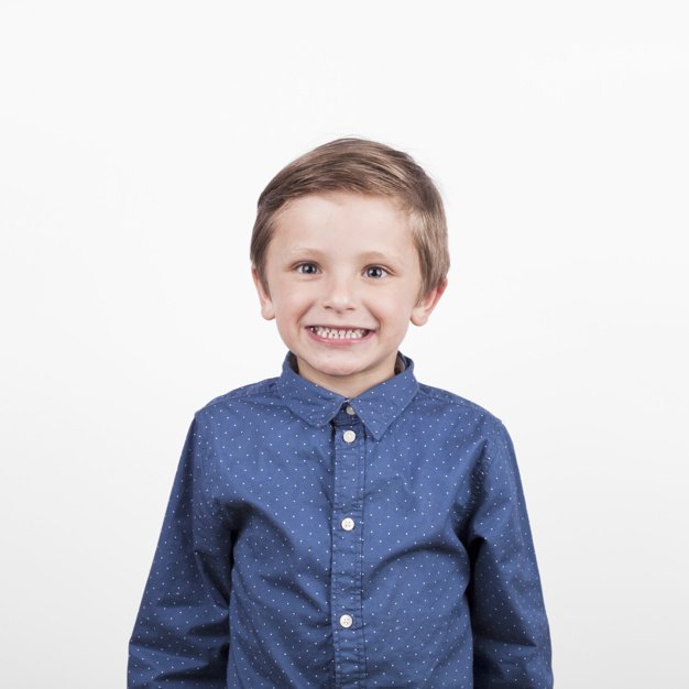 Smiling little boy | Source: Freepik
