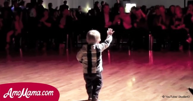 Baby hears favorite song come on, starts to dance. He gives a very proud bow at the end