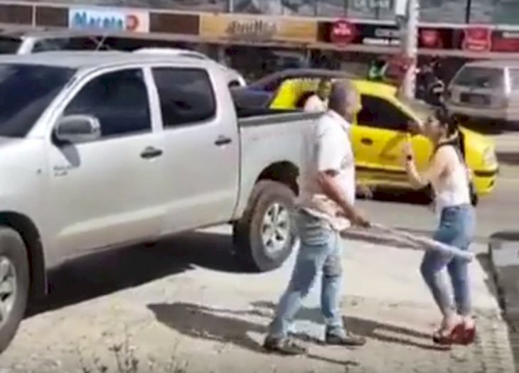 Furious woman filmed confronting her cheating husband with a baseball bat