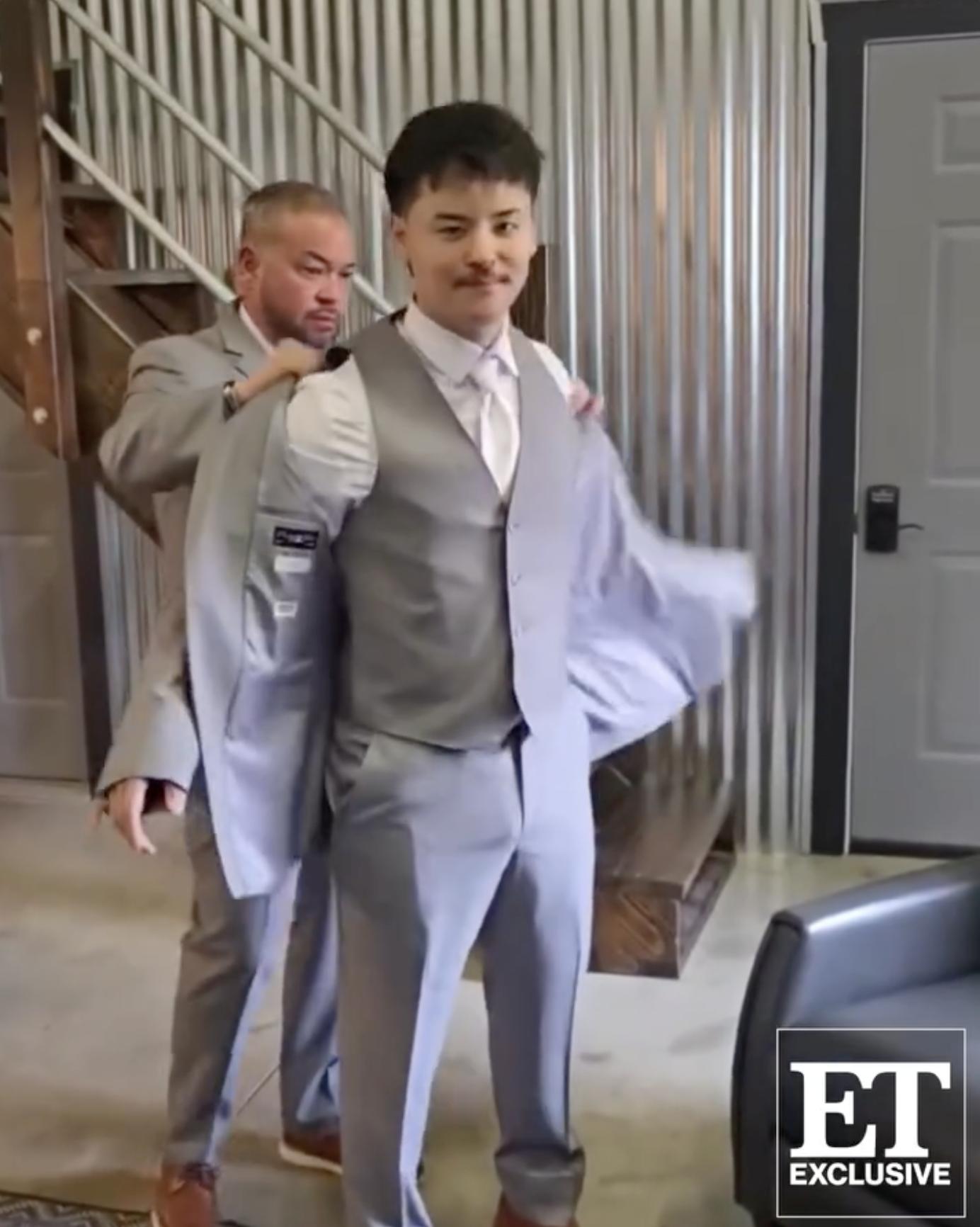Jon Gosselin helps son Collin Gosselin into his jacket before the ceremony, as posted on November 23, 2025 | Source: Instagram/entertainmenttonight