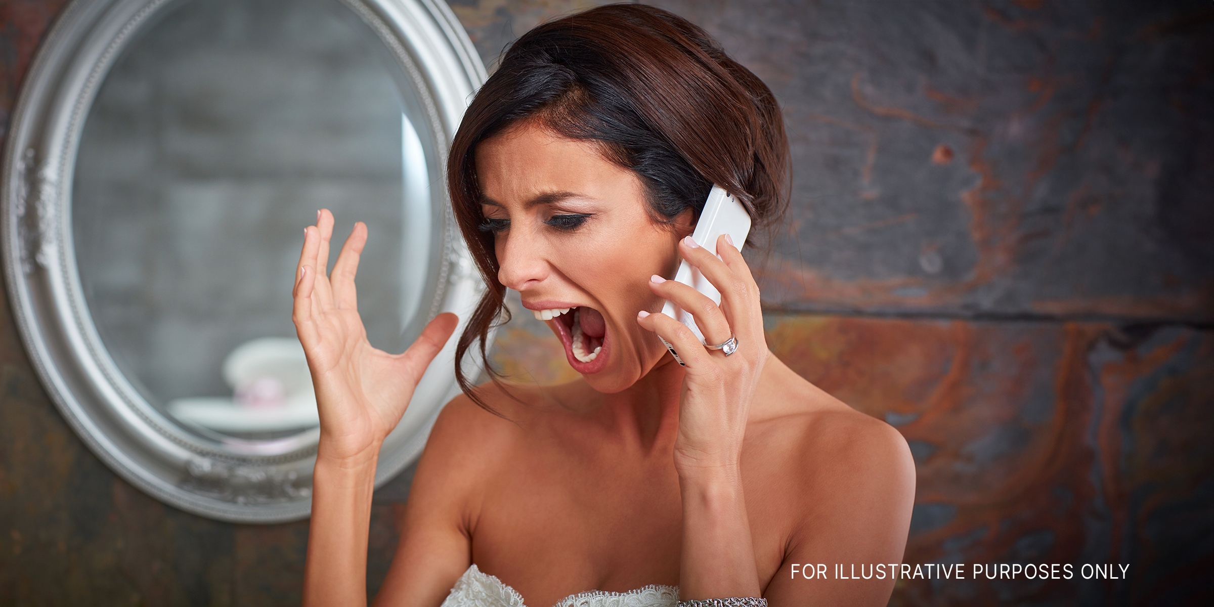 An angry bride yelling on the phone | Source: Shutterstock