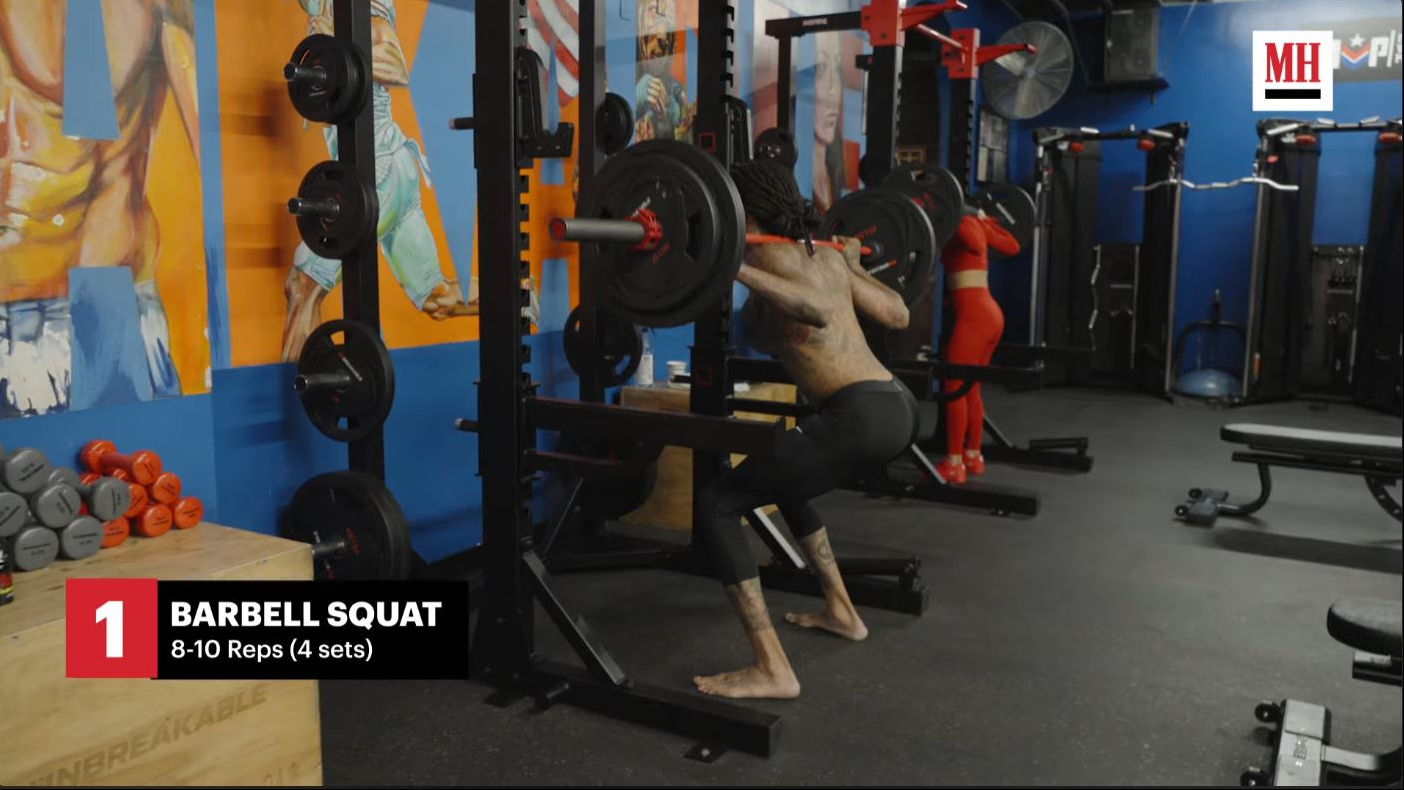 Wiz Khalifa completes a set of barbell squats during a lower-body workout featured in the training session. | Source: YouTube/Men's Health