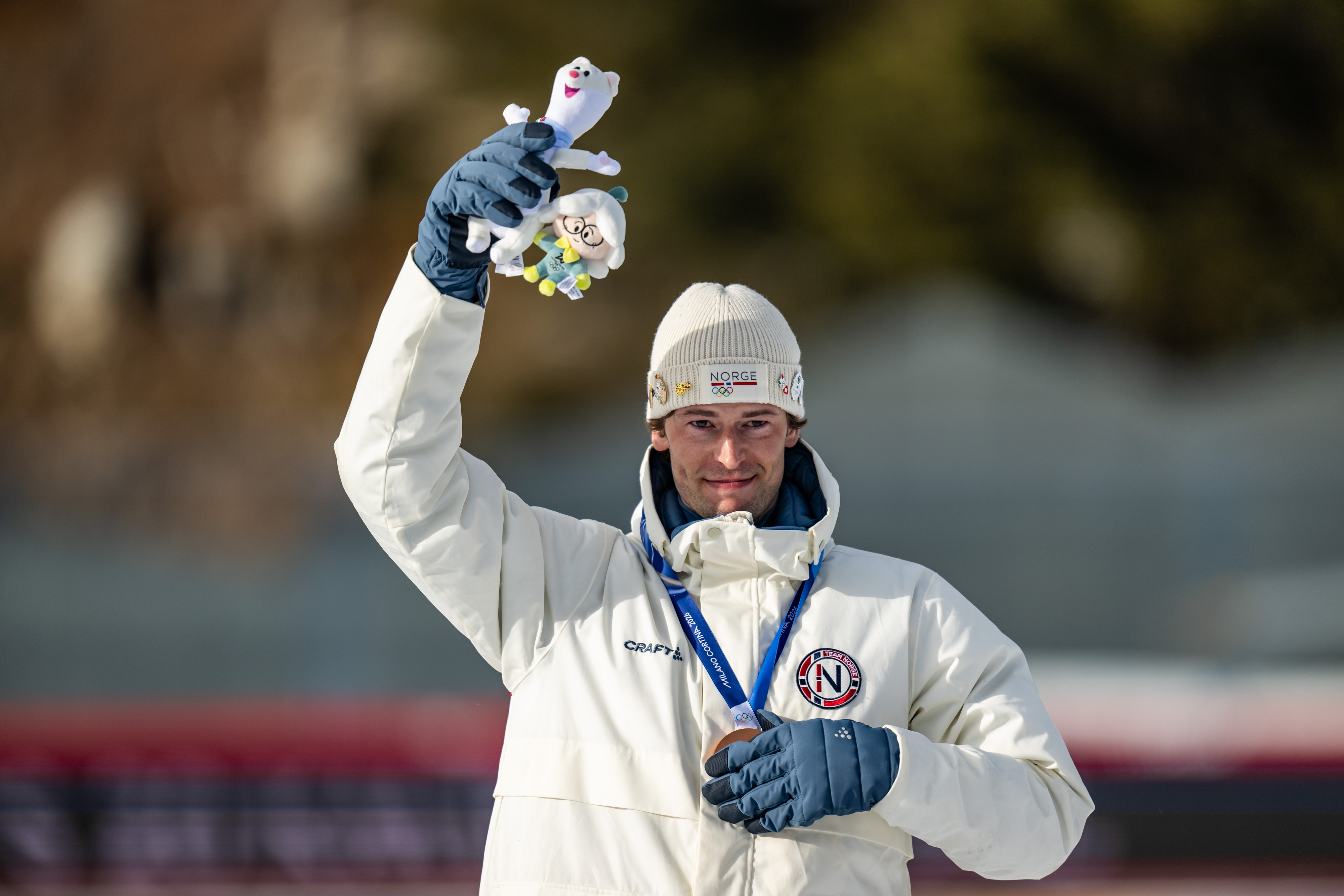 Bronze Medalist Sturla Holm Lægreid reacts during the medal ceremony for the Men 20km Individual on Day 4 of the Milano Cortina 2026 Winter Olympic Games on February 10, 2026, in Antholz-Anterselva, Italy. | Source: Getty Images