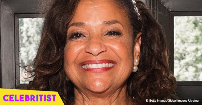 Debbie Allen shows off her dance skills in red top and long white skirt 