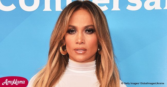 Jennifer Lopez reveals ample cleavage in plunging white gown as she shares photo of herself