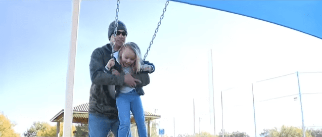 Brian Zach and his adopted daughter Kaila playing together | Photo: YouTube/ABC15 Arizona