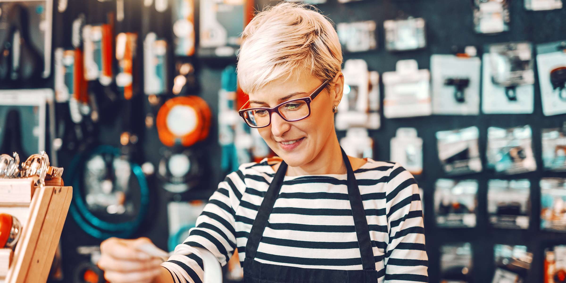 A woman working in a retail store | Source: Shutterstock