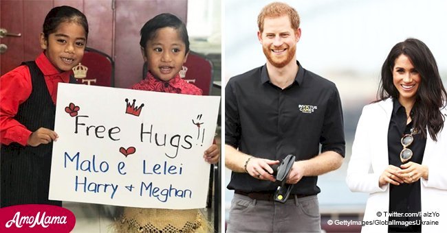 Boy falls to the ground as he fails to share 'free hugs' with Meghan and Harry