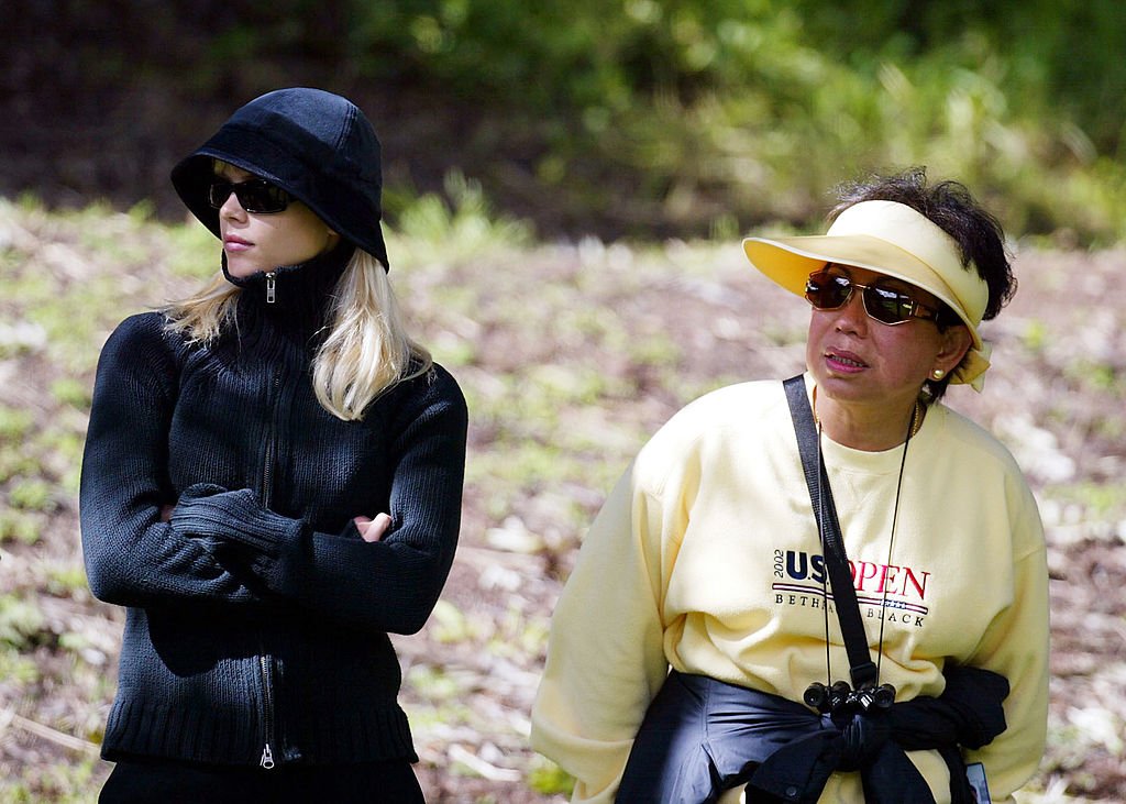 Elin Nordegren and Tiger Woods’ mom, Kultida Woods, look on during the 3rd round of the WGC- Accenture Match Play Championship at the La Costa Resort and Spa, on February 27, 2004, in Carlsbad, California. | Source: Getty Images