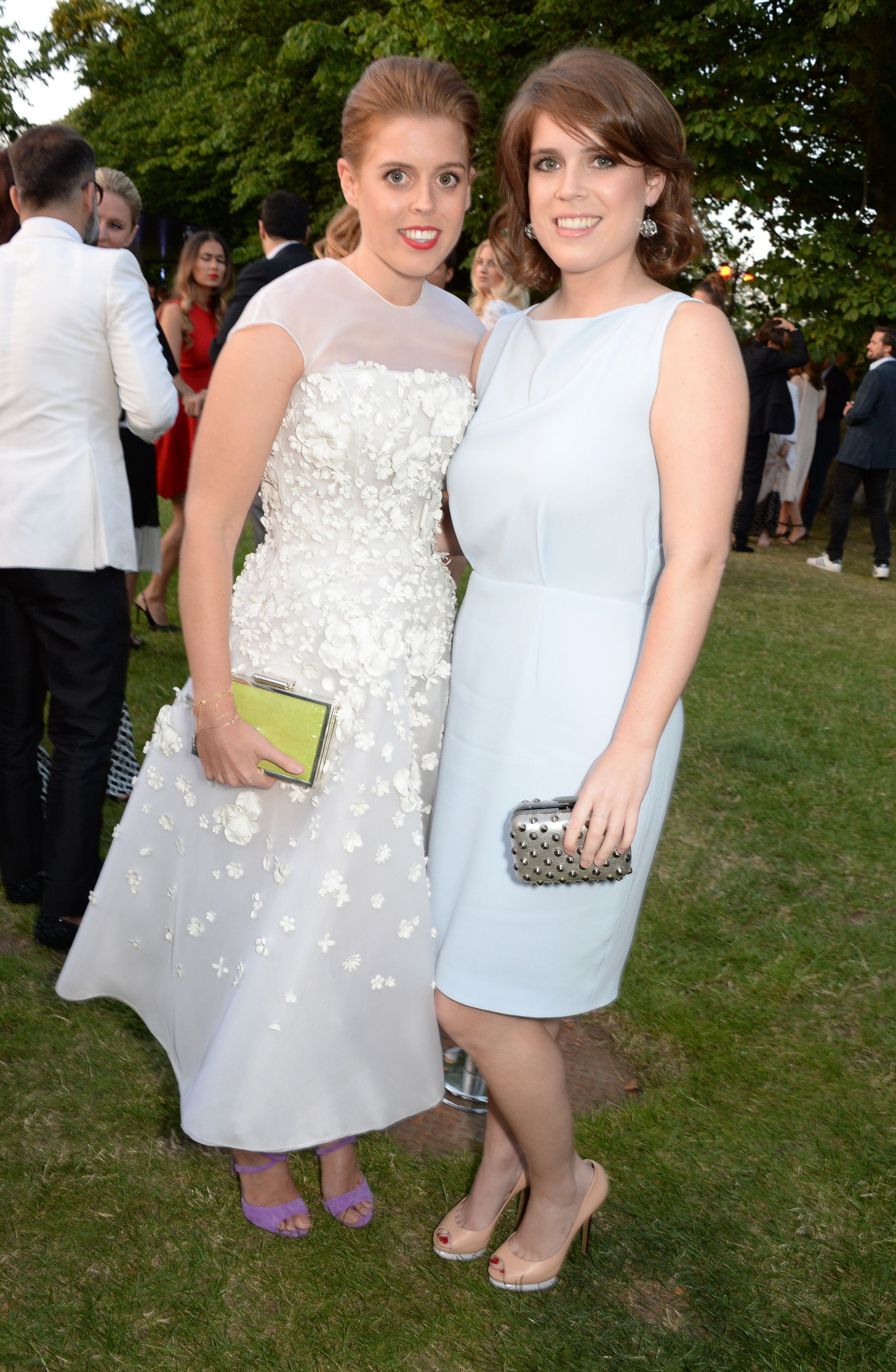 Princess Beatrice and Princess Eugenie of York during The Serpentine Gallery Summer Party co-hosted by Brioni at The Serpentine Gallery on July 1, 2014 in London, England. | Source: Getty Images