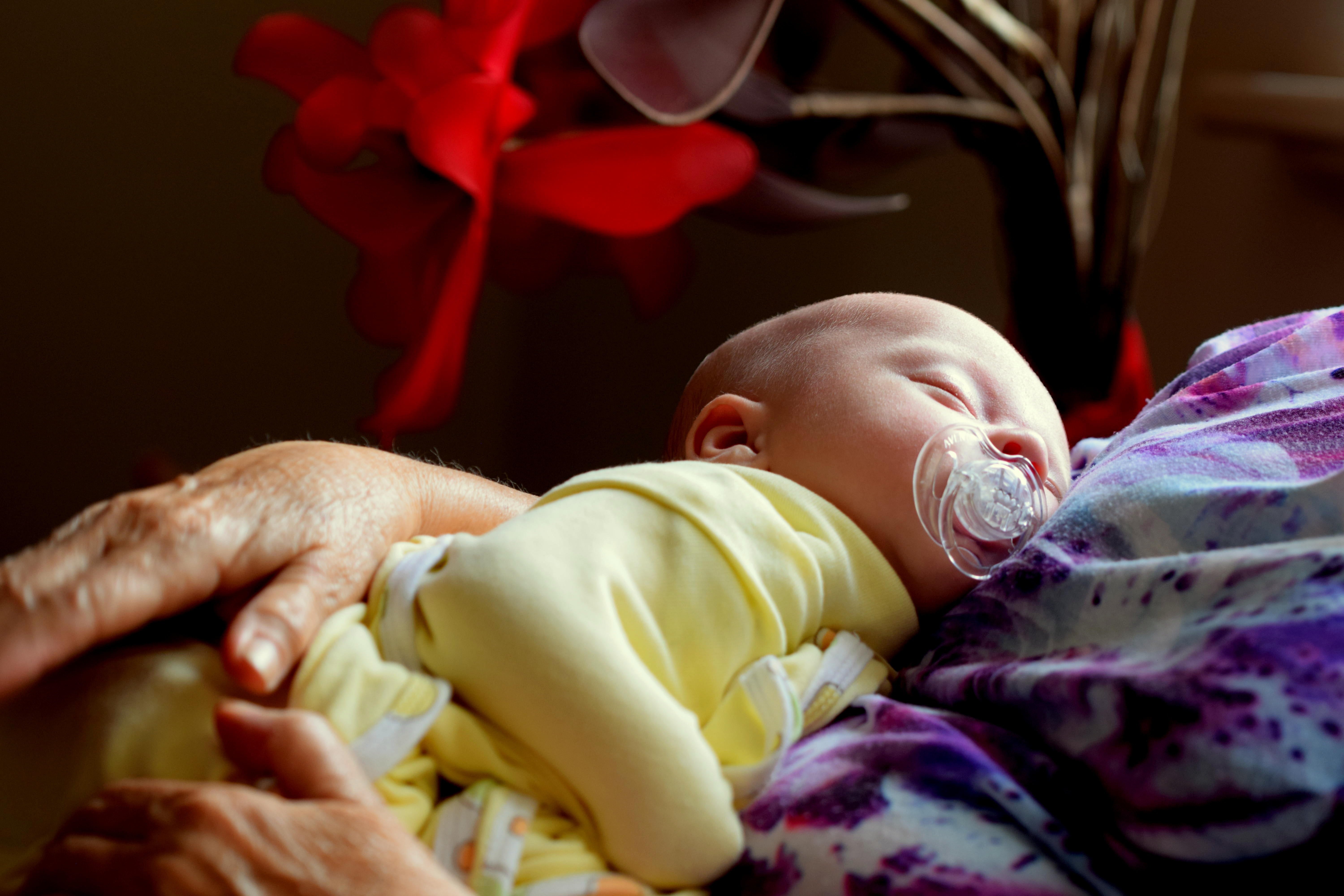 OP's mother-in-law sent her a picture message of her grandchild asleep in her arms | Photo: Pexels