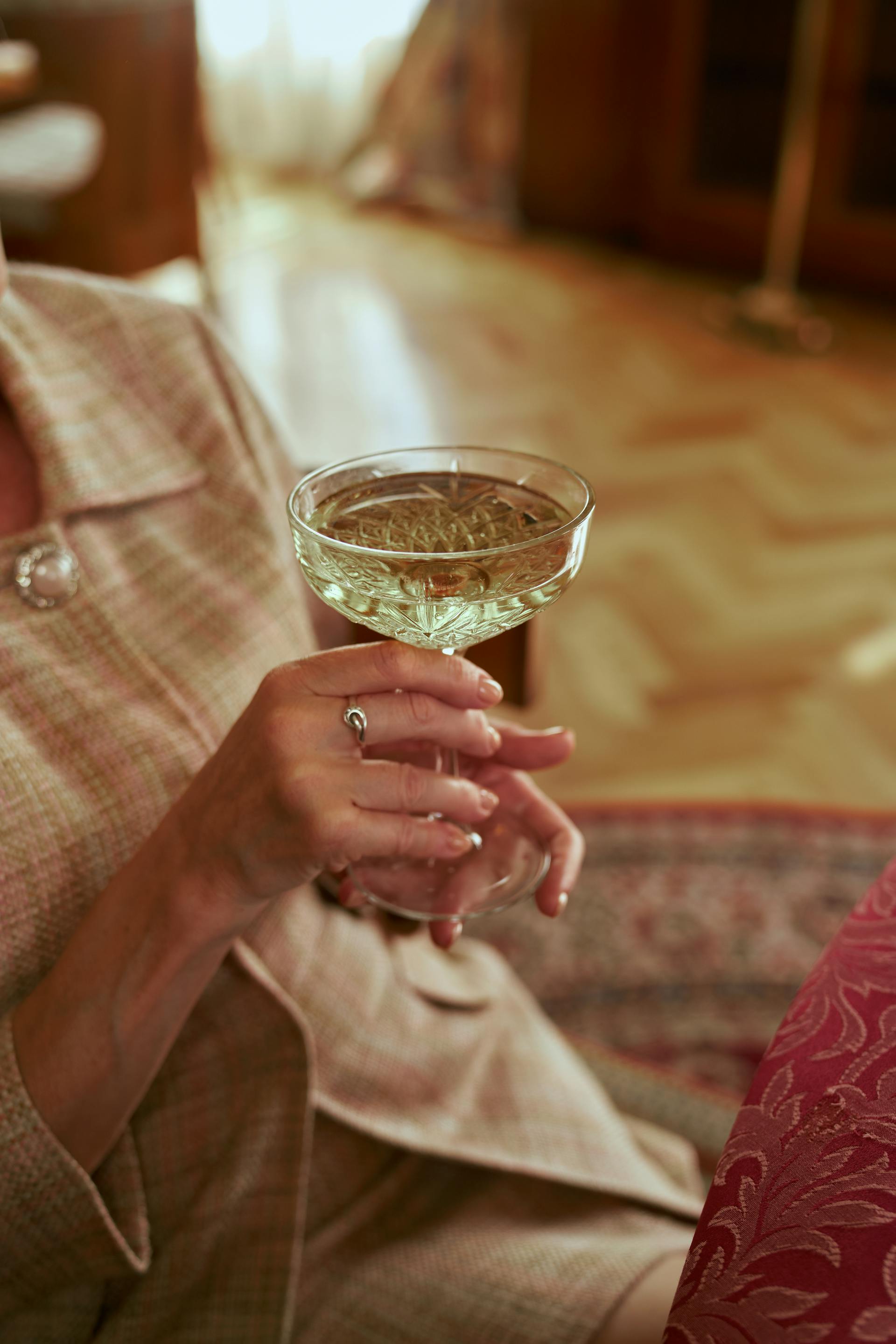 A woman holding a glass | Source: Pexels