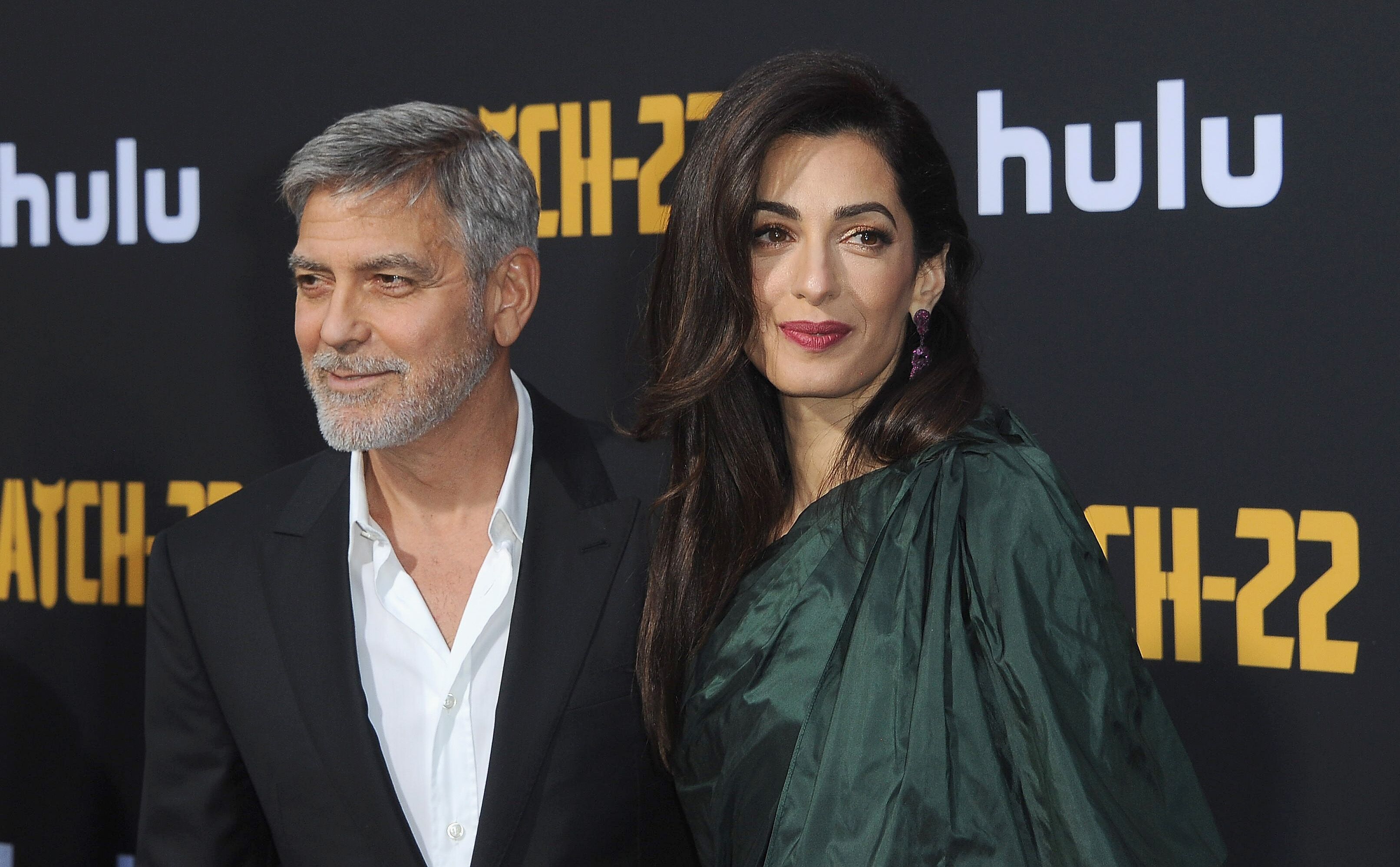 George Clooney and Amal Clooney at the premiere of "Catch-22" in 2019 in Hollywood | Source: Getty Images