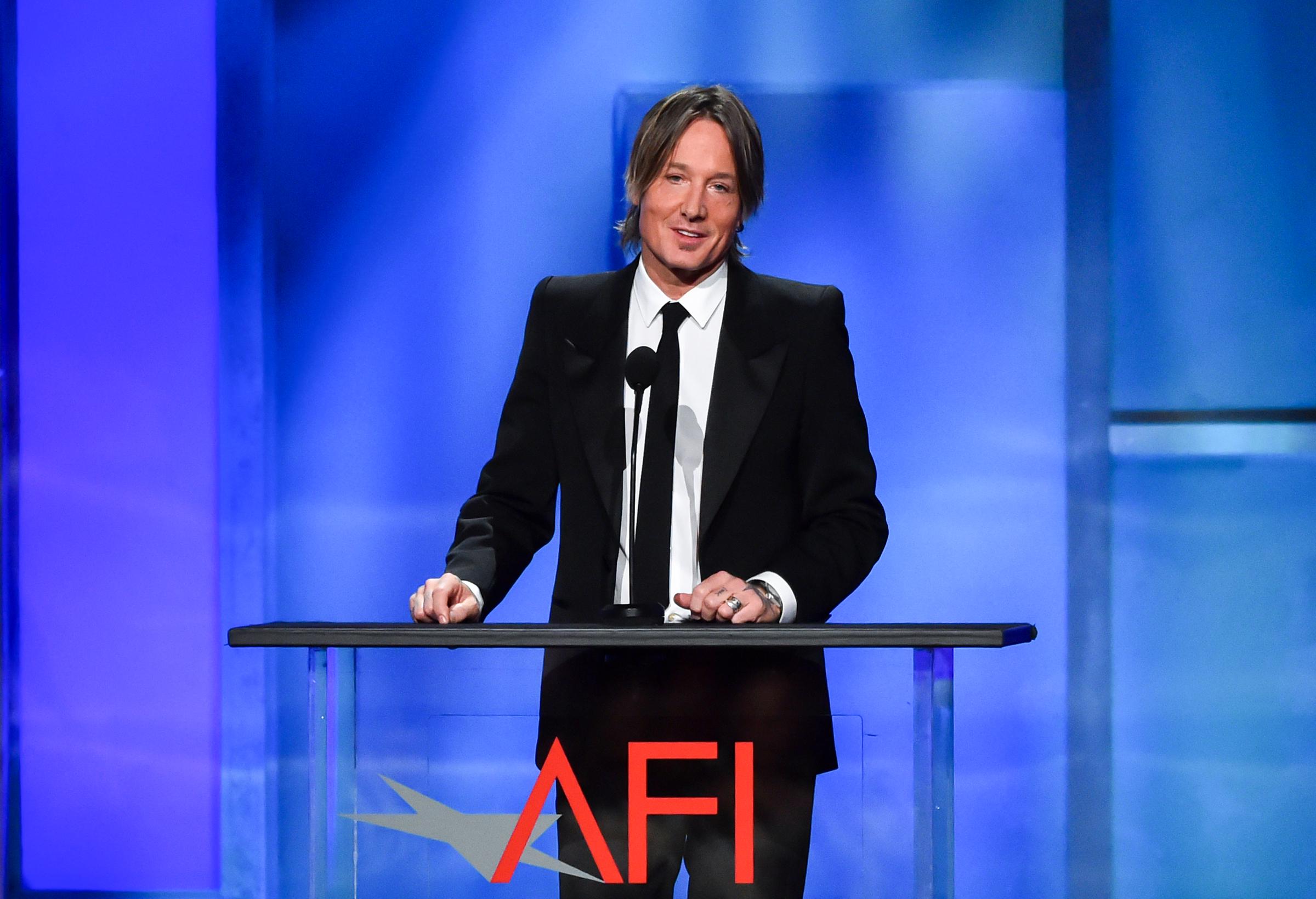 Keith Urban speaks onstage during the 49th AFI Life Achievement Award Gala Tribute celebrating Nicole Kidman in Hollywood, California, on April 27, 2024. | Source: Getty Images