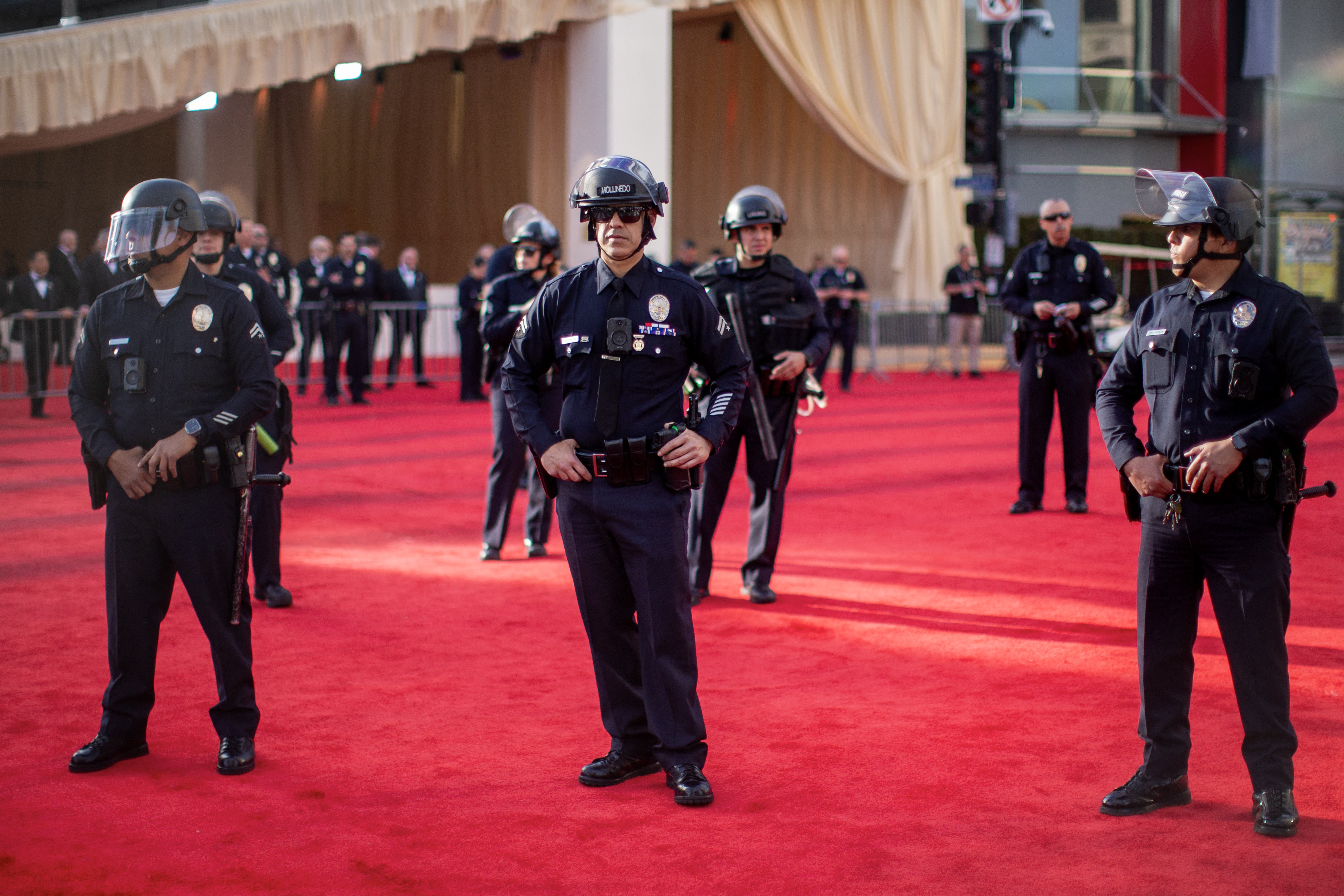 Police officers stand guard at the red carpet area near the Dolby Theatre during the 96th Academy Awards in Los Angeles, California, on March 10, 2024 | Source: Getty Images