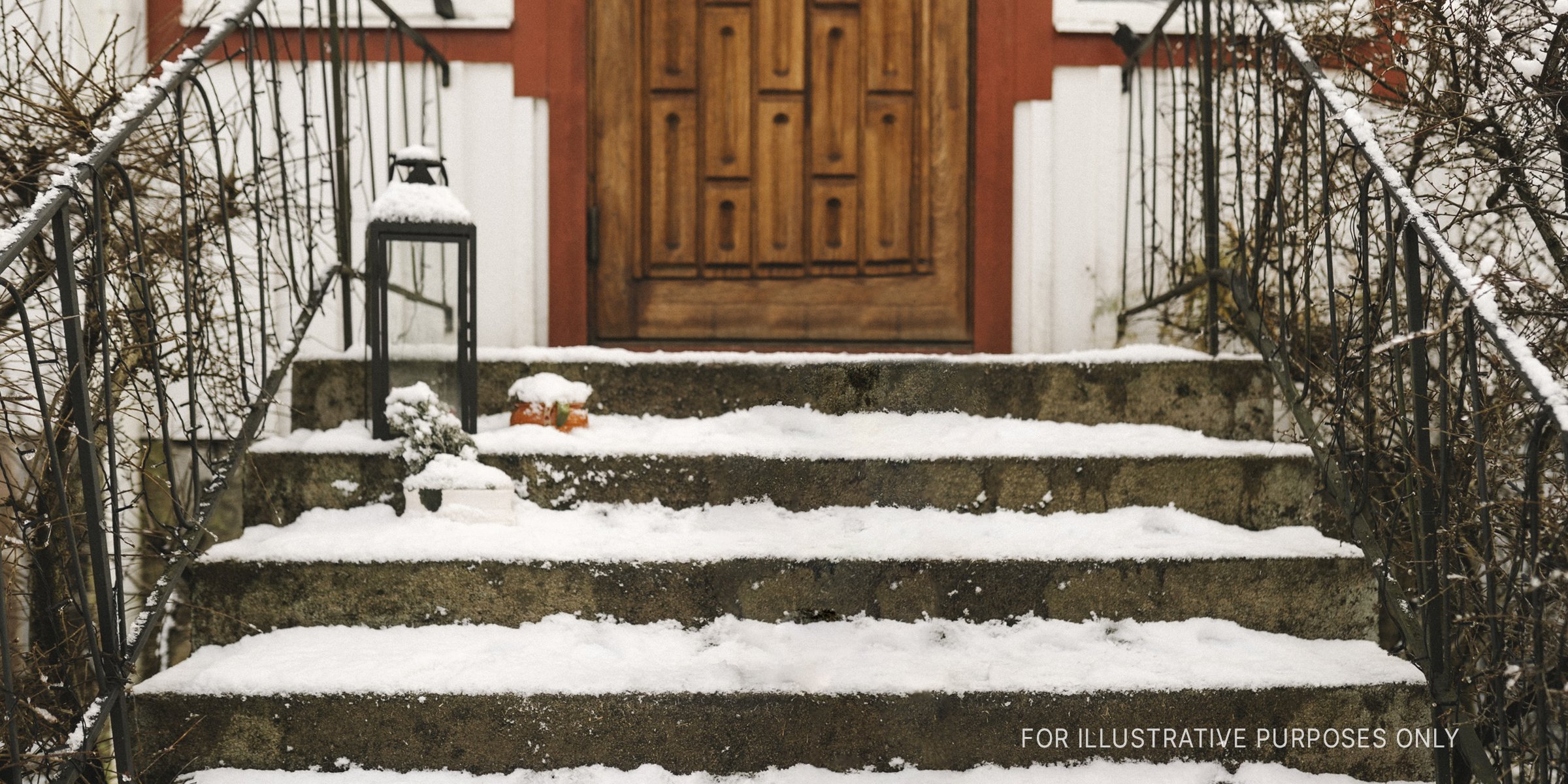 Snow-clad stairs leading to a doorway | Source: Getty Images