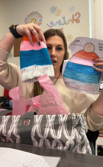 Mrs. White showing some of the hats her mother created for her second-grade class for Christmas on TikTok on December 5, 2023 | Source: TikTok/Mrs. White