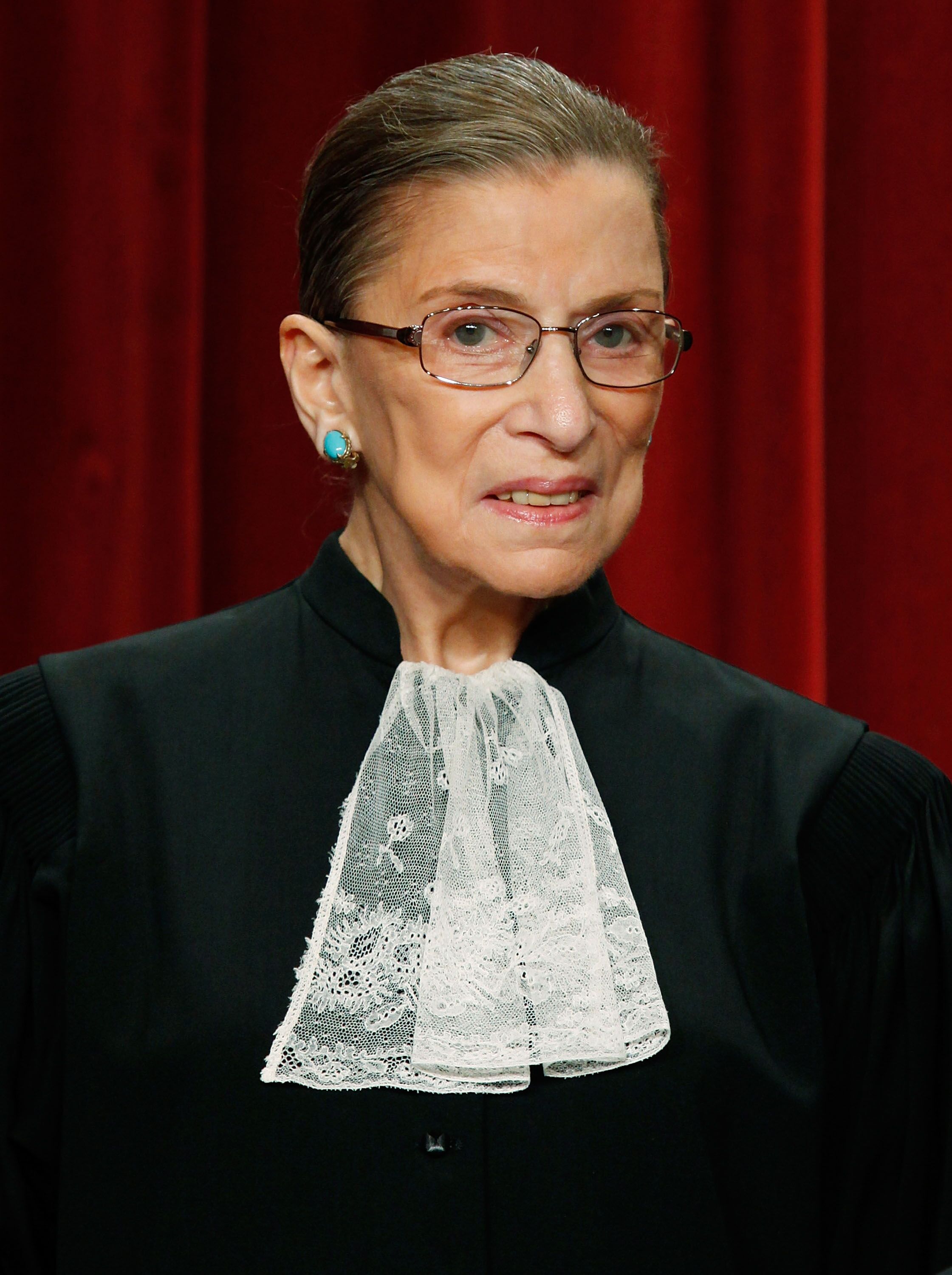 Associate Justice Ruth Bader Ginsburg poses during a group photograph at the Supreme Court. | Source: Getty Images