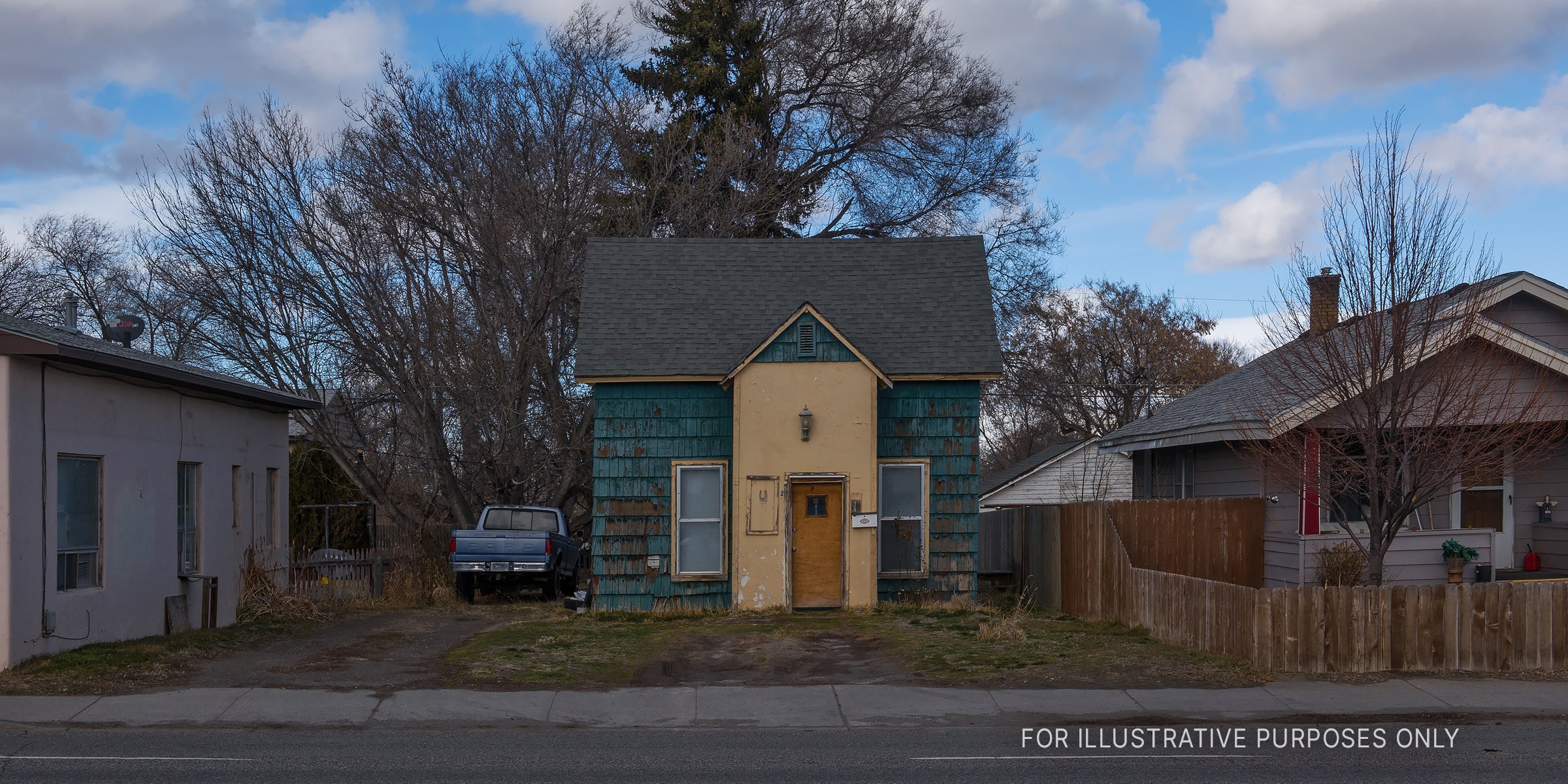 Source: Shutterstock | A small, shabby house in a neighborhood. 