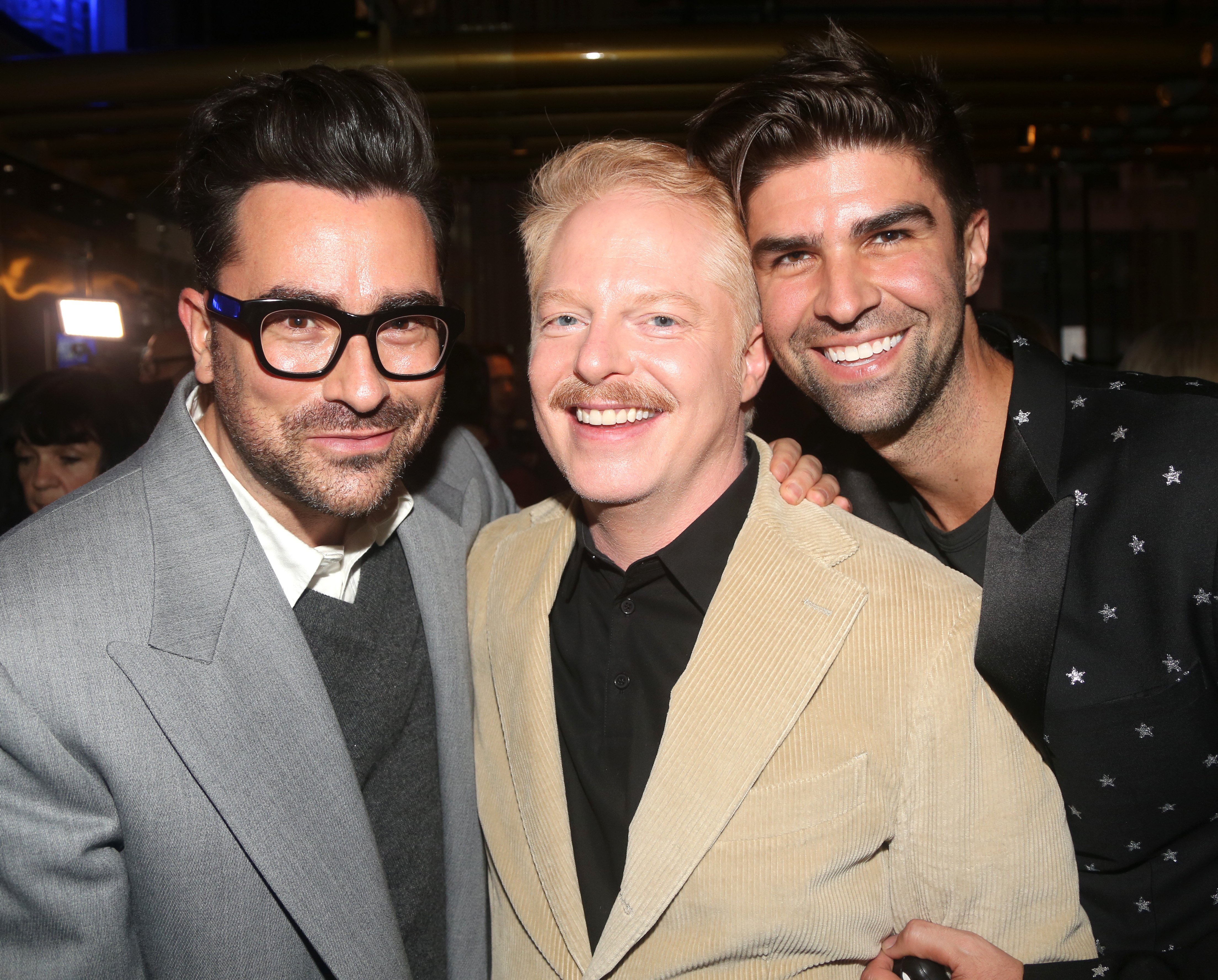 Dan Levy, Jesse Tyler Ferguson, and Justin Mikita photographed at the opening night party for the Broadway Second Stage Theater production of "Take Me Out"  in New York City. | Source: Getty Images